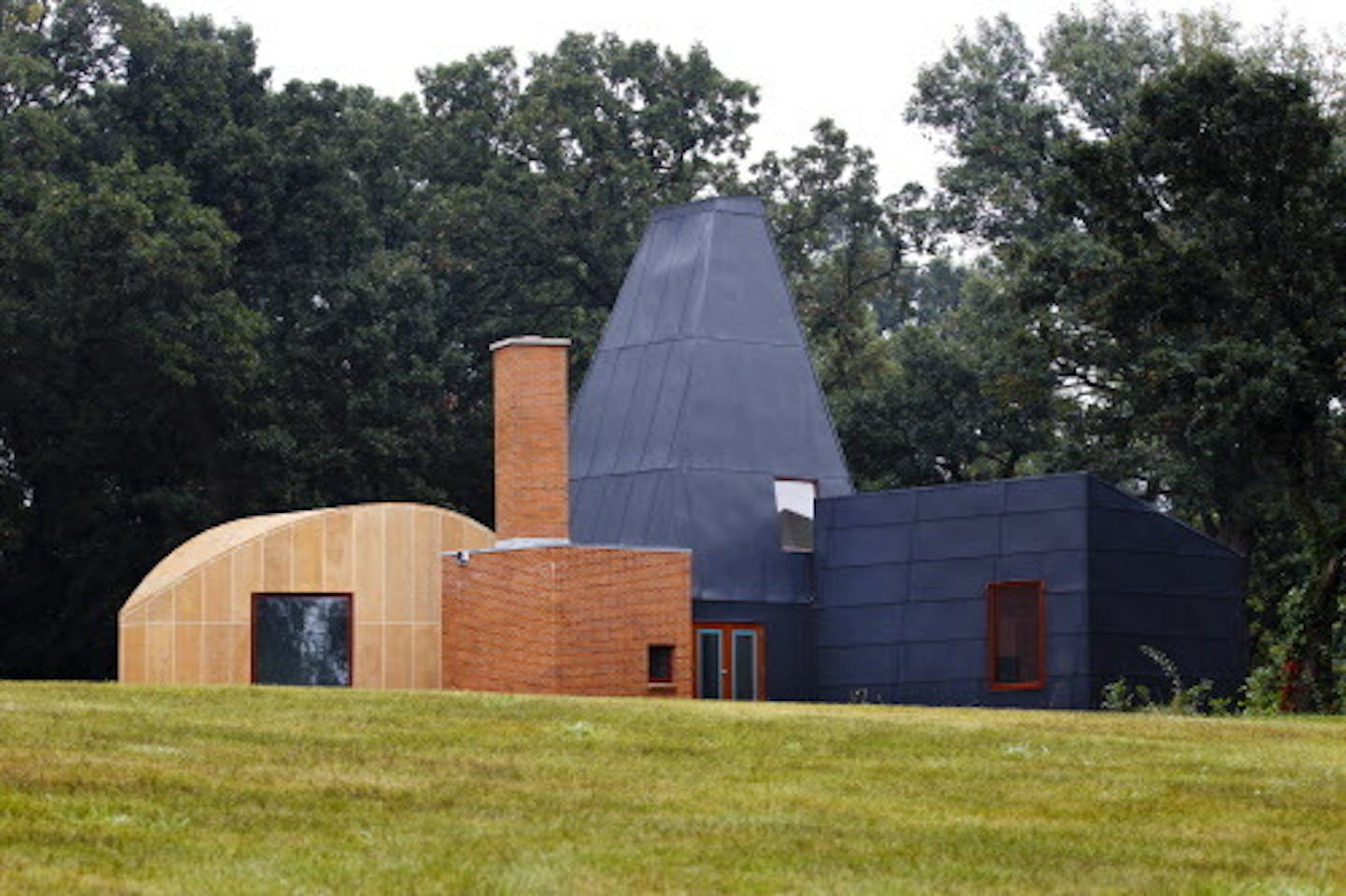 credit: Mike Ekern, University of St. Thomas  The Winton Guest House, designed by renowned architect Frank Gehry, stands assembled in its final location at the University of St. Thomas' Gainey Center in Owatonna, Minn. August 31, 2011.  The house was moved, in pieces, to this spot from its original location in Orono, Minn.