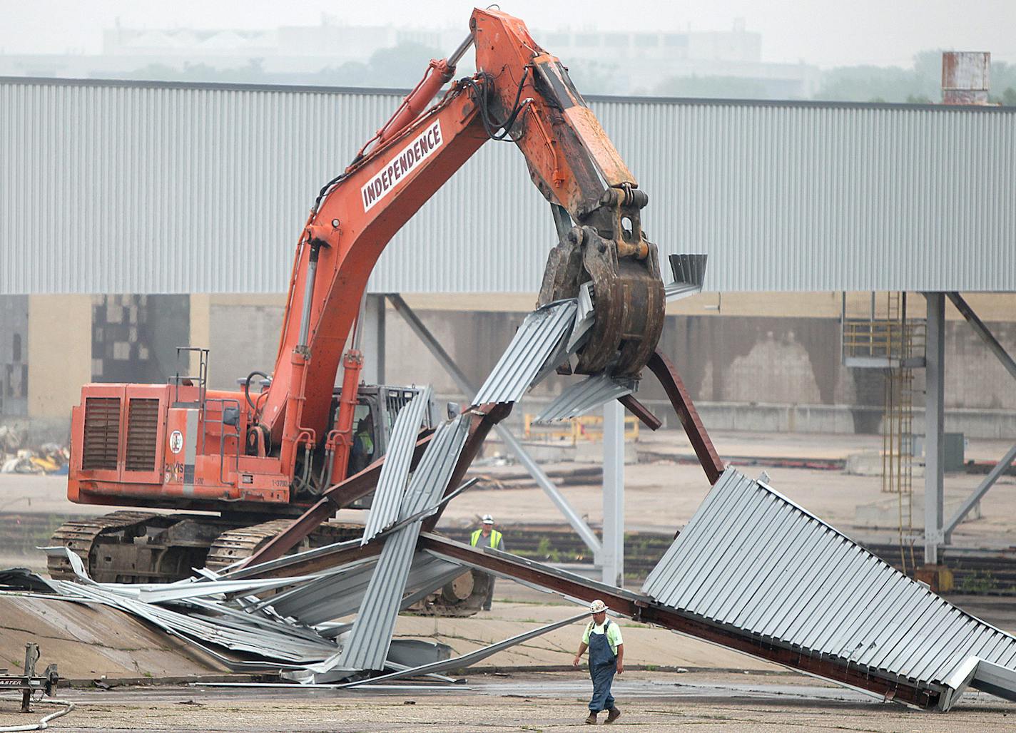 Crews took down the first piece of the paint building, where Conrad worked. &#x201c;Just to see it go down is sad,&#x201d; he said.