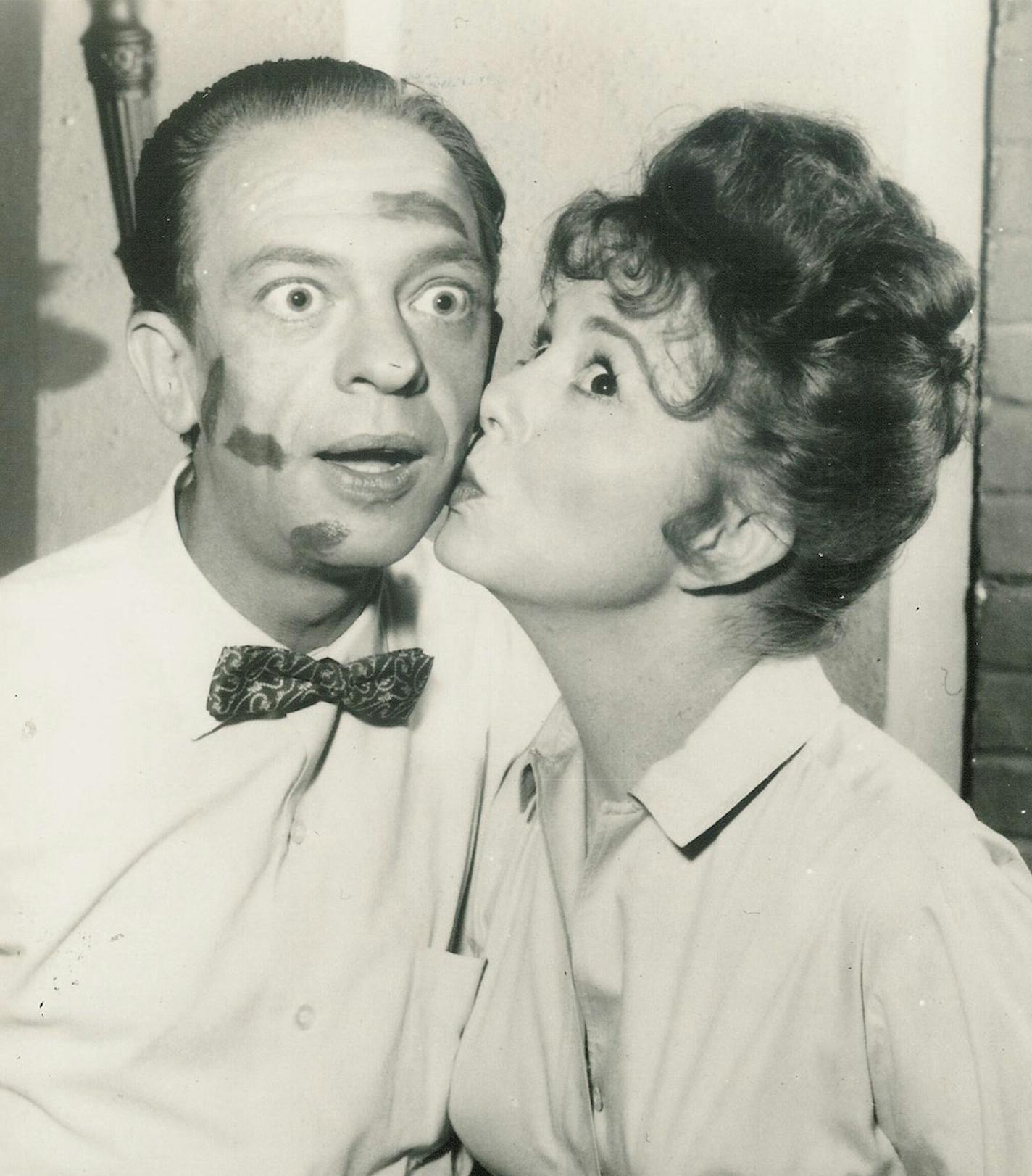 Thelma Lou (Betty Lynn) kissing Barney (Don Knotts) in a publicity photo for "The Andy Griffith Show."