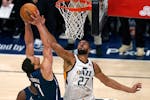 Utah Jazz center Rudy Gobert (27) defends against Dallas Mavericks center Dwight Powell (7) in the second half of Game 4 of an NBA basketball first-ro