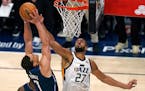 Utah Jazz center Rudy Gobert (27) defends against Dallas Mavericks center Dwight Powell (7) in the second half of Game 4 of an NBA basketball first-ro