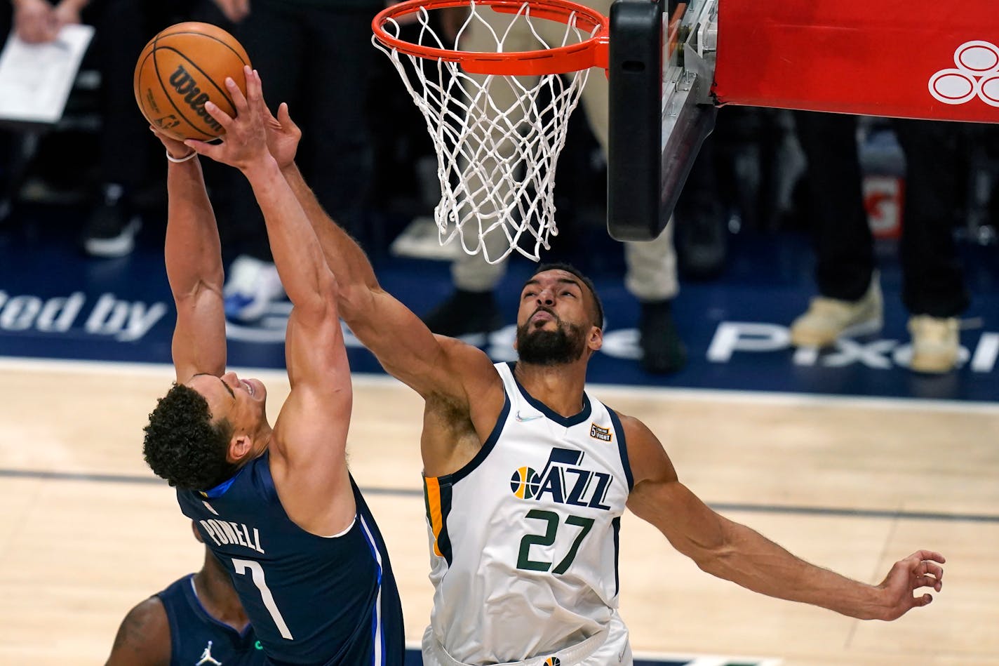 Utah Jazz center Rudy Gobert (27) defends against Dallas Mavericks center Dwight Powell (7) in the second half of Game 4 of an NBA basketball first-round playoff series, Saturday, April 23, 2022, in Salt Lake City. (AP Photo/Rick Bowmer)