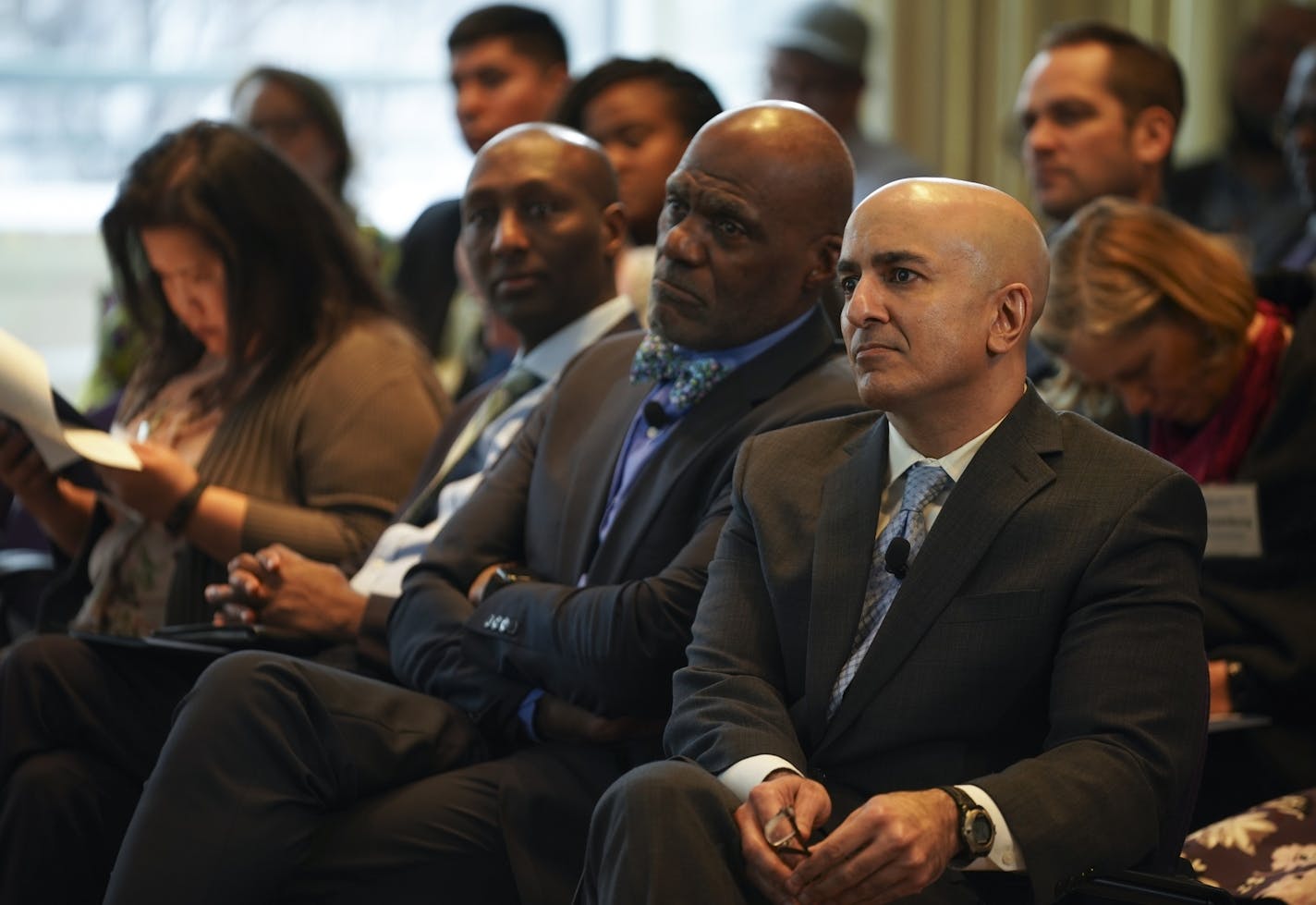 Former Supreme Court Justice Alan Page and Minneapolis Federal Reserve President Neel Kashkari, right, listened to speakers during the first Community Response Panel discussion.