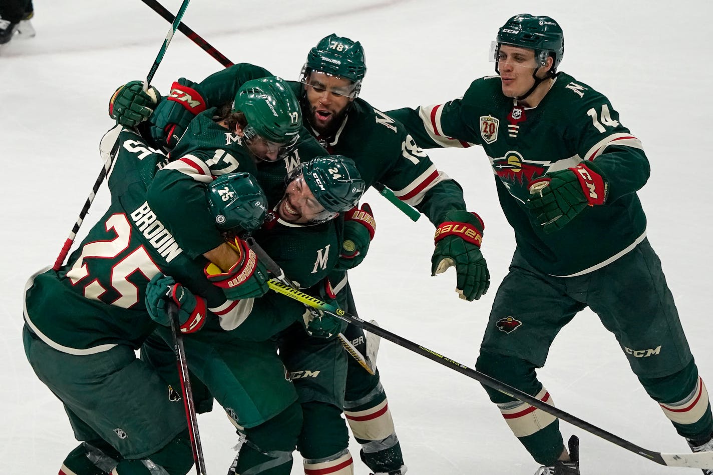 Minnesota Wild defenseman Jonas Brodin (25), from left, celebrated his game-winning goal with teammates Minnesota Wild left wing Marcus Foligno (17), Minnesota Wild defenseman Matt Dumba (24), Minnesota Wild left wing Jordan Greenway (18) and Minnesota Wild center Joel Eriksson Ek (14) during the third period. ] LEILA NAVIDI • leila.navidi@startribune.com