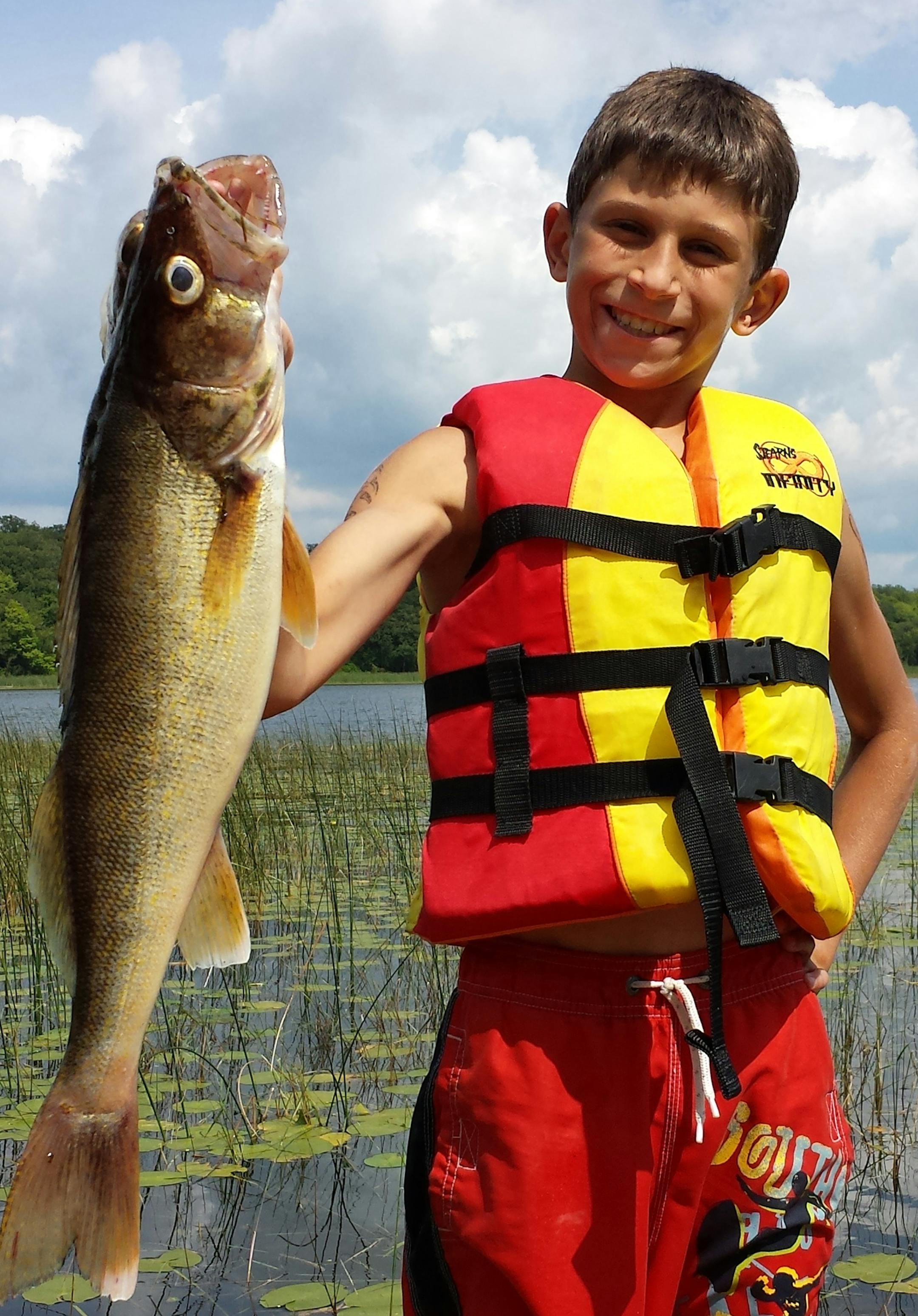 NO NET, NO PROBLEM Sully Scherber, 11, of Buffalo caught this 24 inch walleye with a leach on a Llindy rig in 18-feet of water at his Grandpa Glen's on Star lake near Dent, Minn. At first Sully thought he had a big northern, then discovered it was a lunker walleye. He also discovered his little sisters had removed the landing net from the boat.