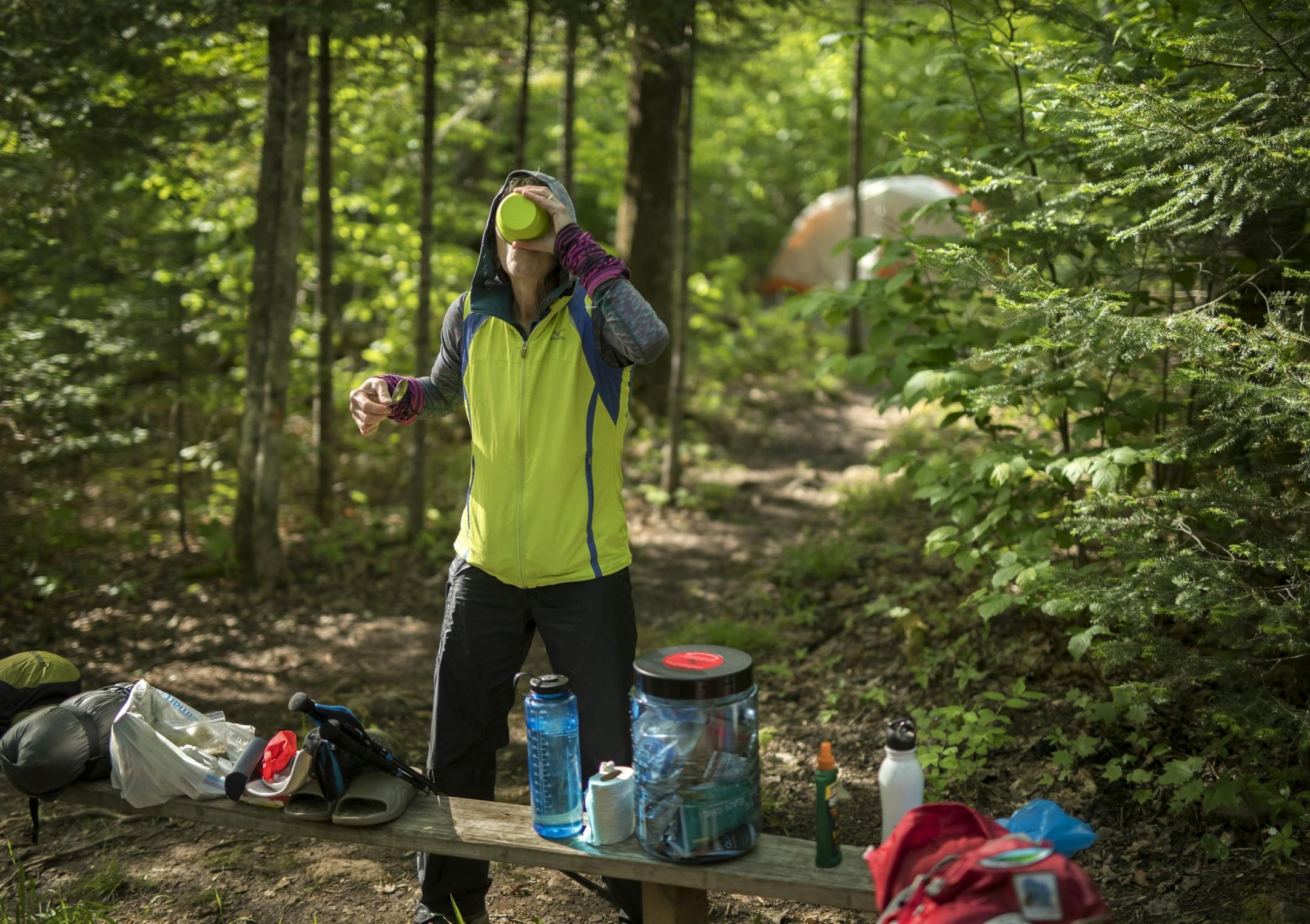 Day-7 - Melanie McManus drinks her breakfast at Reeves Falls Camp before heading out on the trail on Day 7.