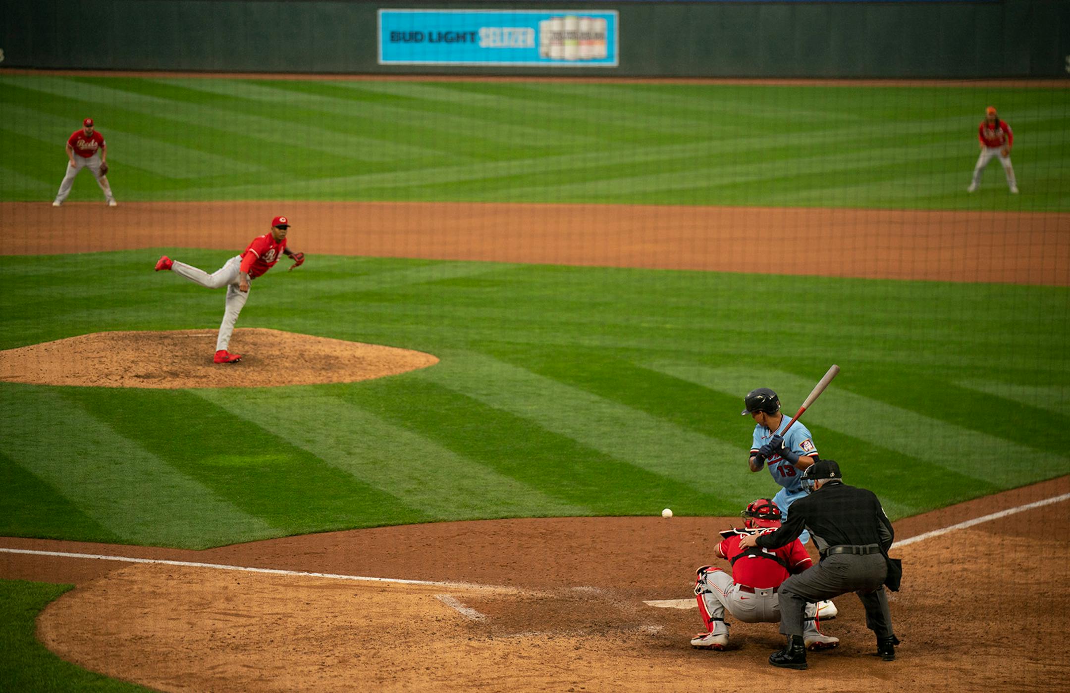 Minnesota Twins shortstop Ehire Adrianza (13) struck out looking at pitch from Cincinnati Reds relief pitcher Raisel Iglesias (26) to end the game in the 10th inning.