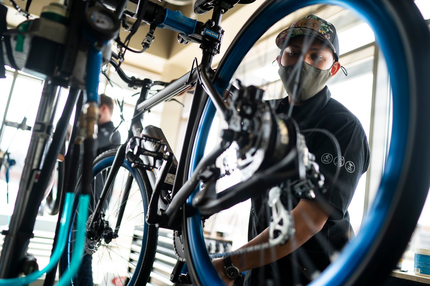 DJ Yann assembled a new electric bike for a customer at Erik's Bike Shop in Richfield, Minn., on Friday, March 26, 2021.