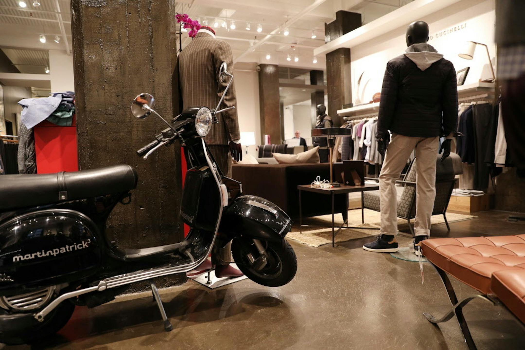 A scooter sat tucked against a pillar in the store.