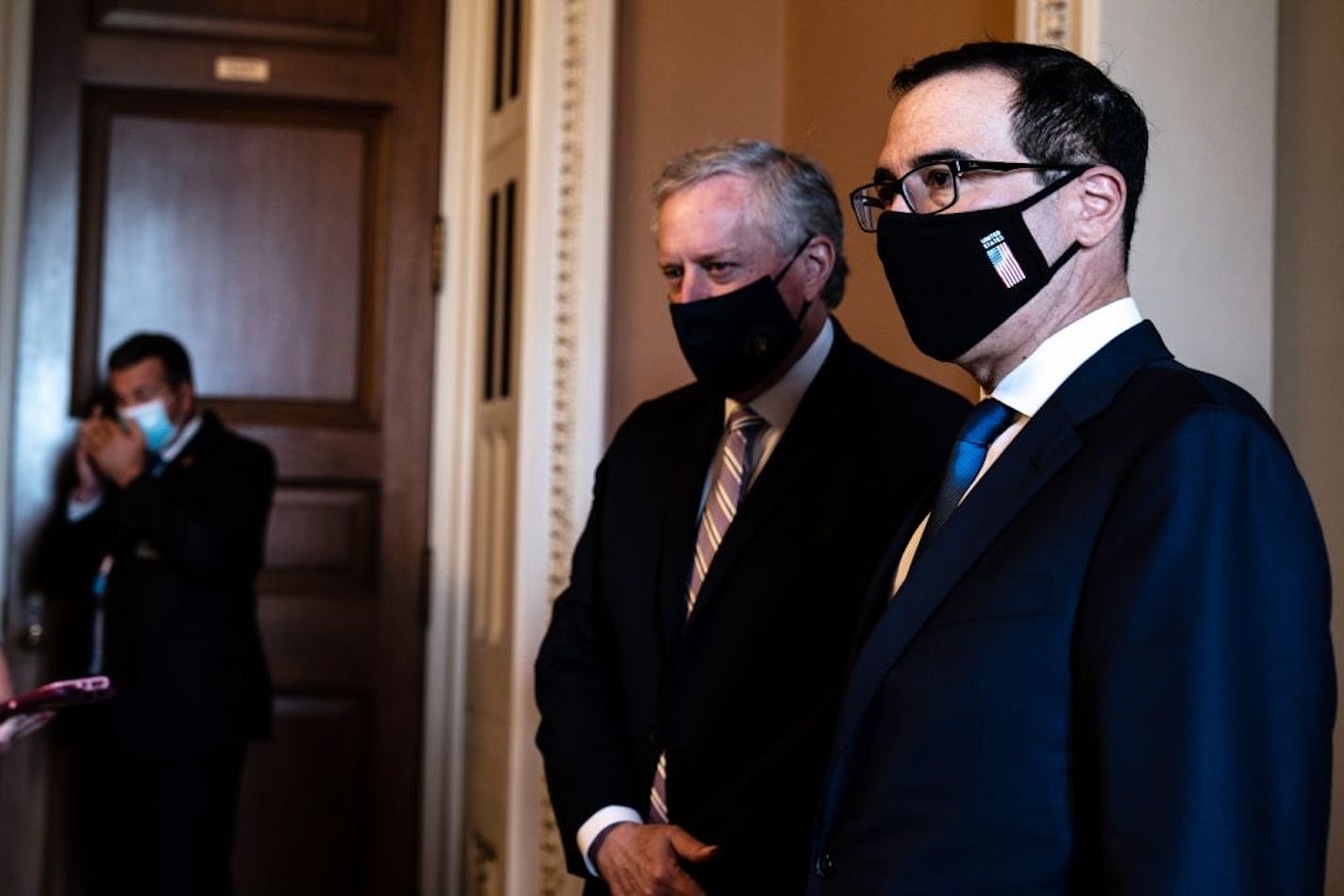 Treasury Secretary Steven Mnuchin, right, and White House Chief of Staff Mark Meadows, speak to reporters following a meeting with Senate Majority Leader Mitch McConnell (R-Ky.), at the Capitol in Washington, on Thursday, July 23, 2020. The White House and Senate Republicans neared agreement on Thursday on a new economic rescue proposal that includes another round of stimulus payments to individuals, additional aid to small businesses and a partial extension of enhanced unemployment benefits, ac