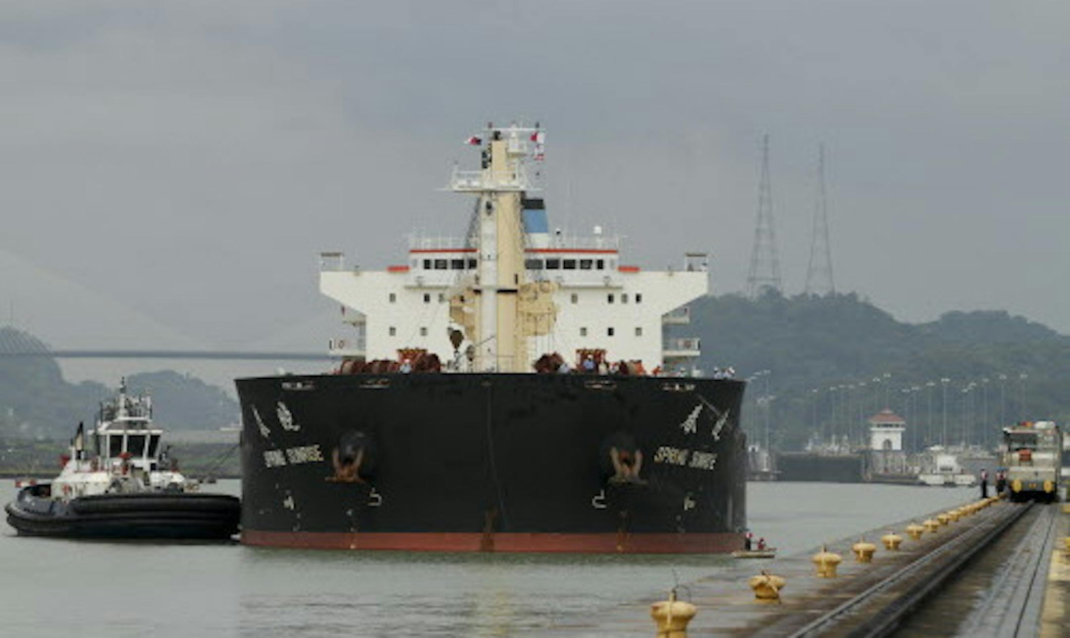 In this Aug. 4, 2014, photo, a cargo ship is approaches the Miraflores Locks of Panama Canal in Panama City. Disputes between the government and the projectís European contractor, as well as labor unions, mean an already-delayed December 2015 completion deadline for the canal expansion project is unlikely to be met. (AP Photo/Arnulfo Franco)