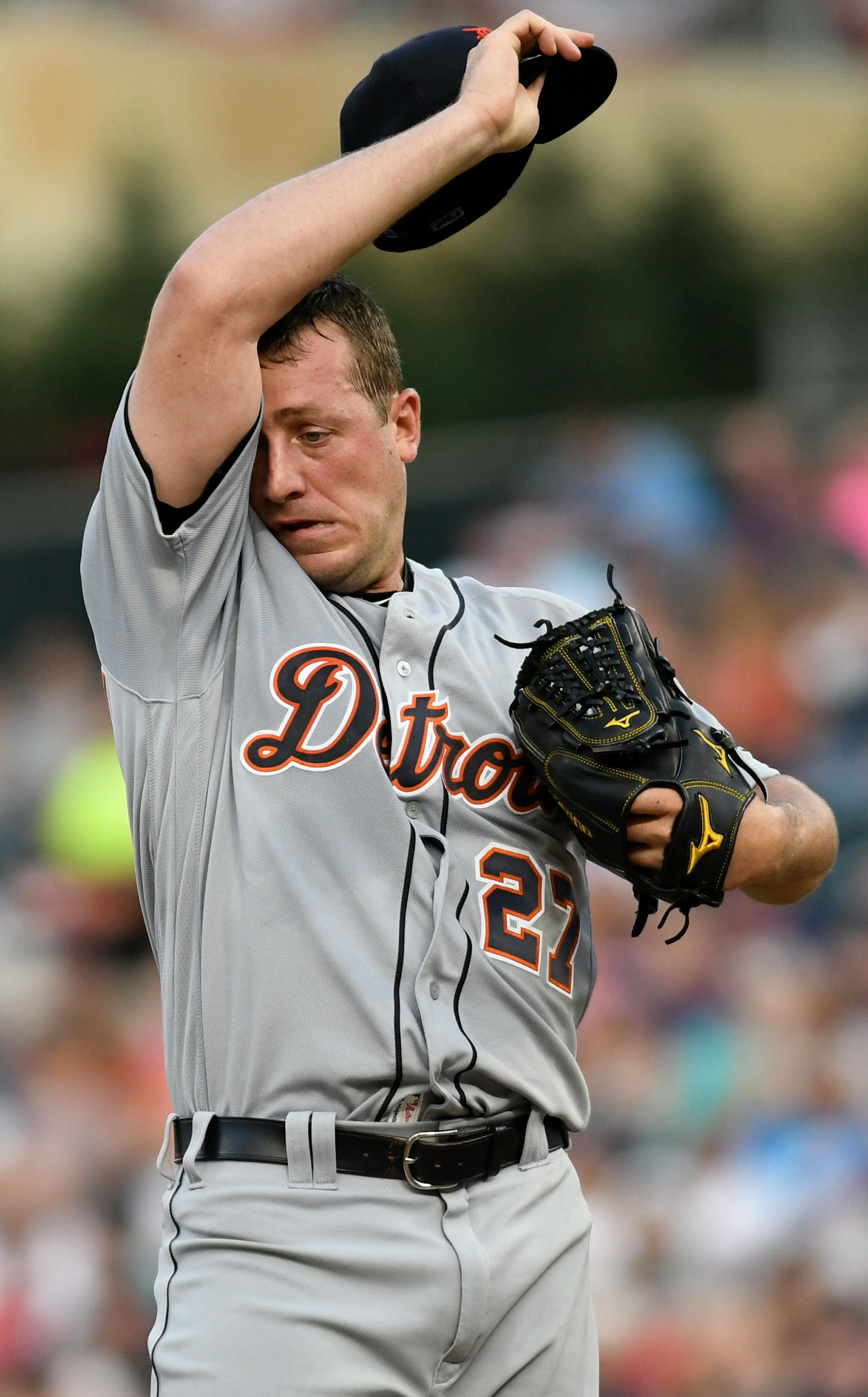 Detroit Tigers pitcher Jordan Zimmermann wipes his brow after giving up a single to Minnesota Twins' Jason Castro during the fourth inning of a baseball game Saturday, July 22, 2017, in Minneapolis. (AP Photo/Tom Olmscheid)
