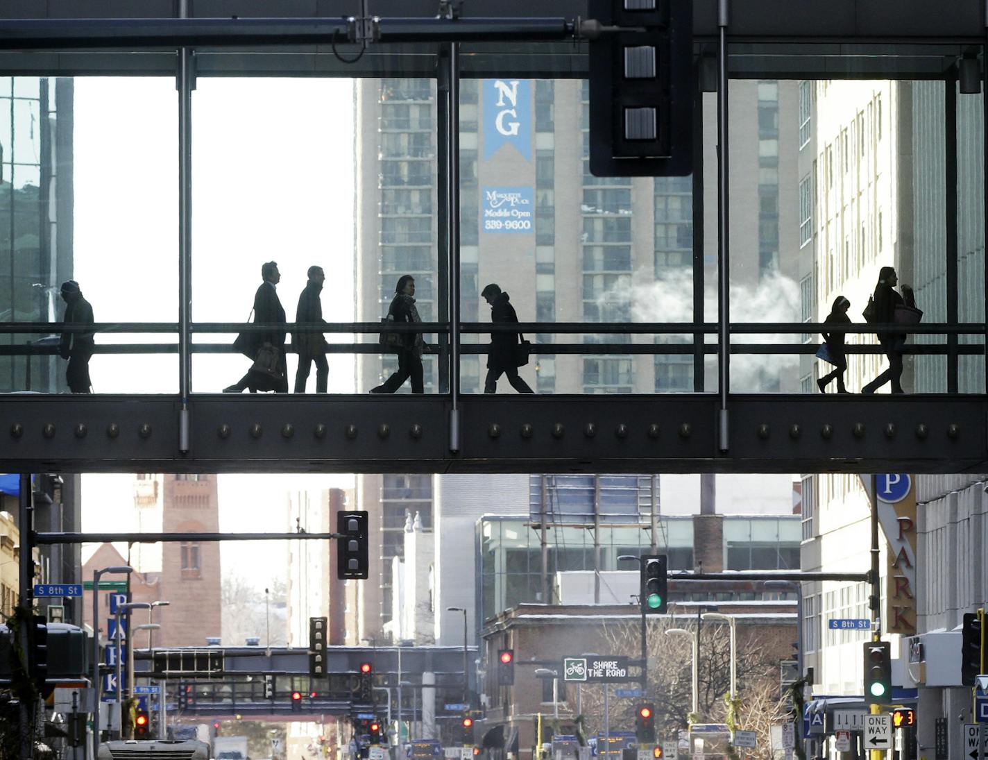 The climate-controlled skyway system in Minneapolis provides warmth for people moving from building to building as another polar blast brought sub-zero temperatures with wind chills in the minus-40's, Monday, Jan. 27, 2014. Subzero temperatures, high winds and drifting snow have closed schools and major roadways in Minnesota, with state officials cautioning against unnecessary travel. (AP Photo/Jim Mone)