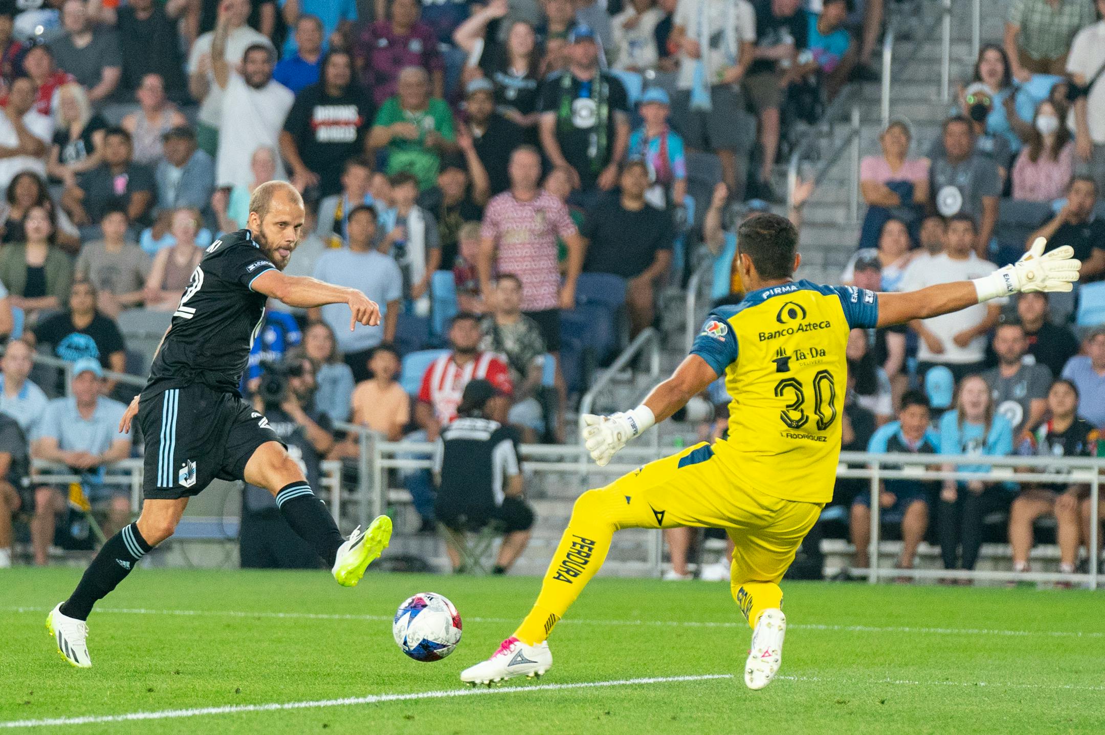 Minnesota United forward Teemu Pukki takes a shot that is saved by Puebla goalkeeper Jesús Rodríguez (30) in the first half of a Leagues Cup match Sunday, July 23, 2023, at Allianz Field St. Paul.