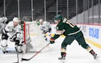 Minnesota Wild left wing Zach Parise (11) tried to set up an assist in the first period which was broken up by Los Angeles Kings defenseman Kurtis Mac