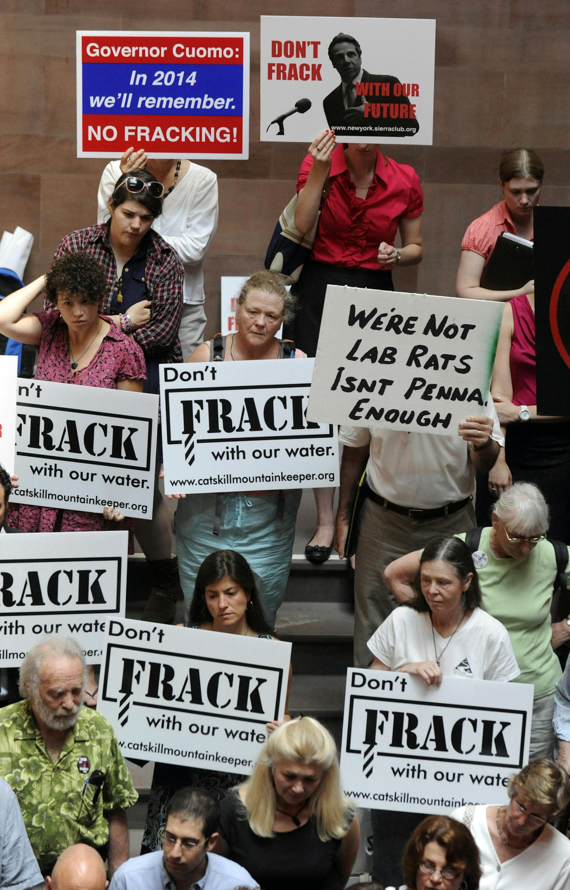 FILE - In this June 20, 2012 file photo, protesters rally against the oil and gas drilling method known as hydraulic fracturing, or "fracking," as the legislative session winds down at the Capitol in Albany, N.Y. In New York, there is a fracking moratorium in effect until a health study is completed. As hydraulic fracturing mobilizes thousands around the country both for and against, industry and some environmental groups in Illinois have come together to draft regulations both sides could live