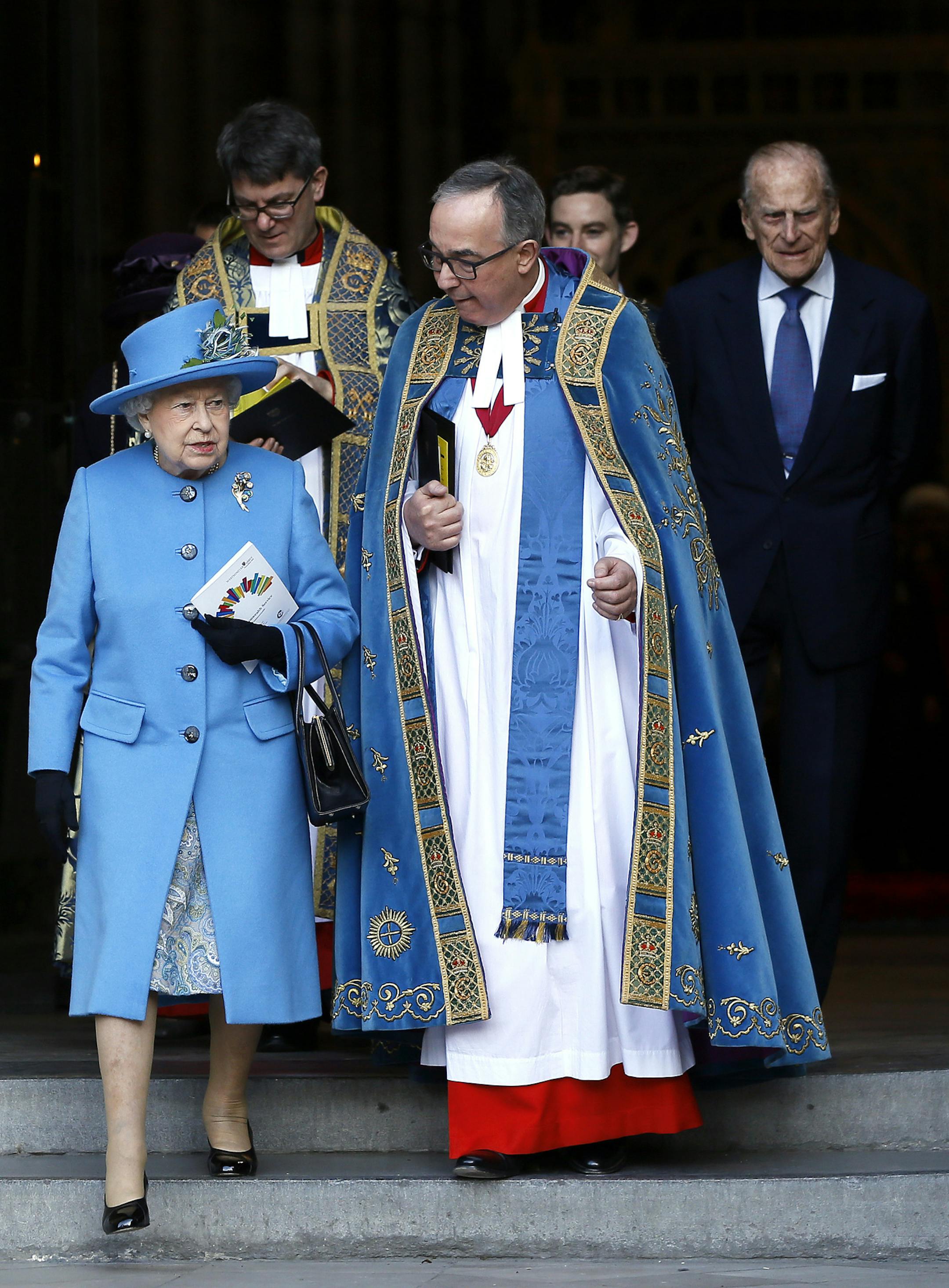 Britain's Queen Elizabeth II , left, leaves with the Dean of Westminster, the Reverend John Hall, after attending the Commonwealth Day service at Westminster Abbey in London, Monday, March 14, 2016. Organised by the Royal Commonwealth Society, the service is the largest annual inter-faith gathering in the United Kingdom. (AP Photo/Kirsty Wigglesworth)