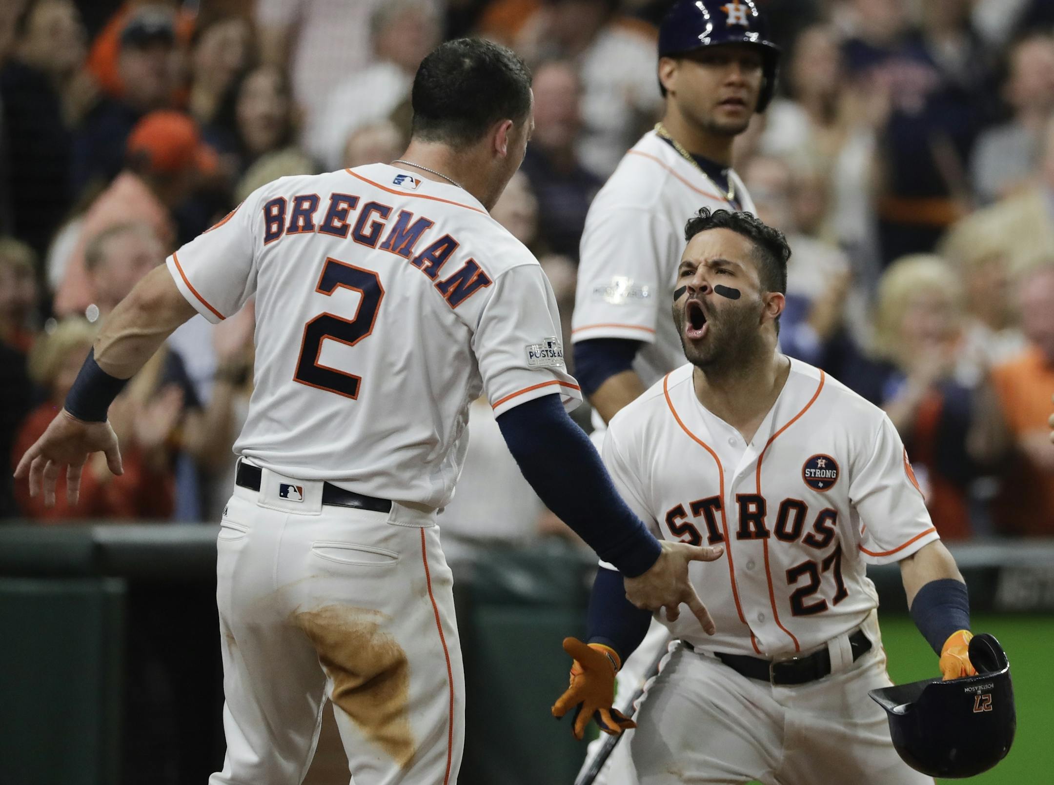 Houston Astros' Jose Altuve is congratulated after hitting a home run during the fifth inning of Game 7 of baseball's American League Championship Series against the New York Yankees Saturday, Oct. 21, 2017, in Houston. (AP Photo/David J. Phillip)