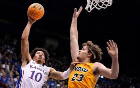 Andrew Morgan (23) defends against Kansas forward Jalen Wilson (10) while playing for North Dakota State.