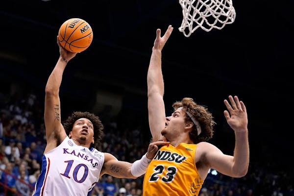 Andrew Morgan (23) defends against Kansas forward Jalen Wilson (10) while playing for North Dakota State.