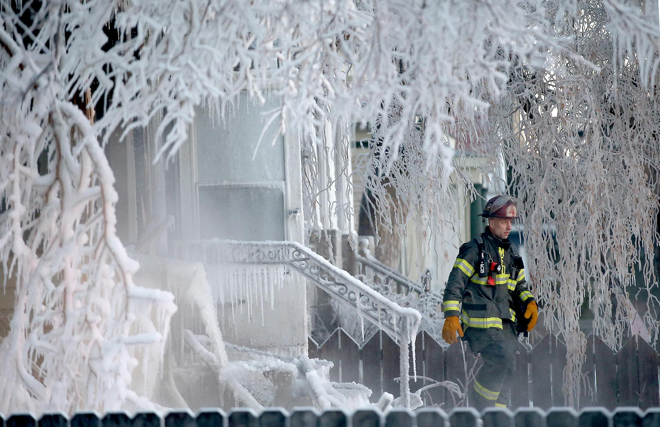 Minneapolis firefighters battled a house fire at the corner of E. 38th Street and Park Avenue South, Thursday, February 26, 2015 in Minneapolis, MN.