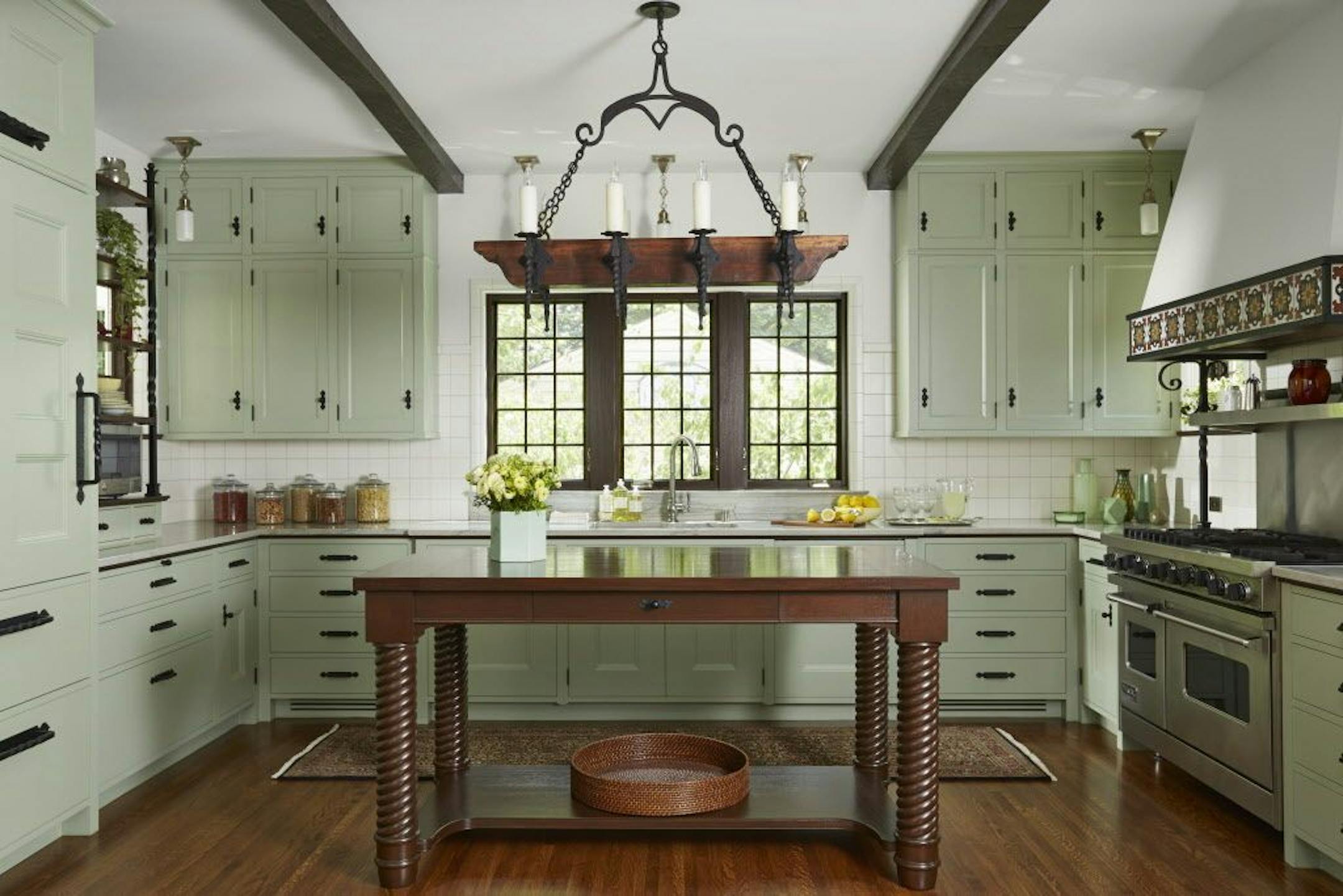 The new kitchen echoes the Mediterranean Revival style of the 1920s house.