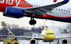 A Spirit Airlines plane was de-iced and a Sun Country plane took off at Minneapolis-St. Paul International Airport earlier this month.