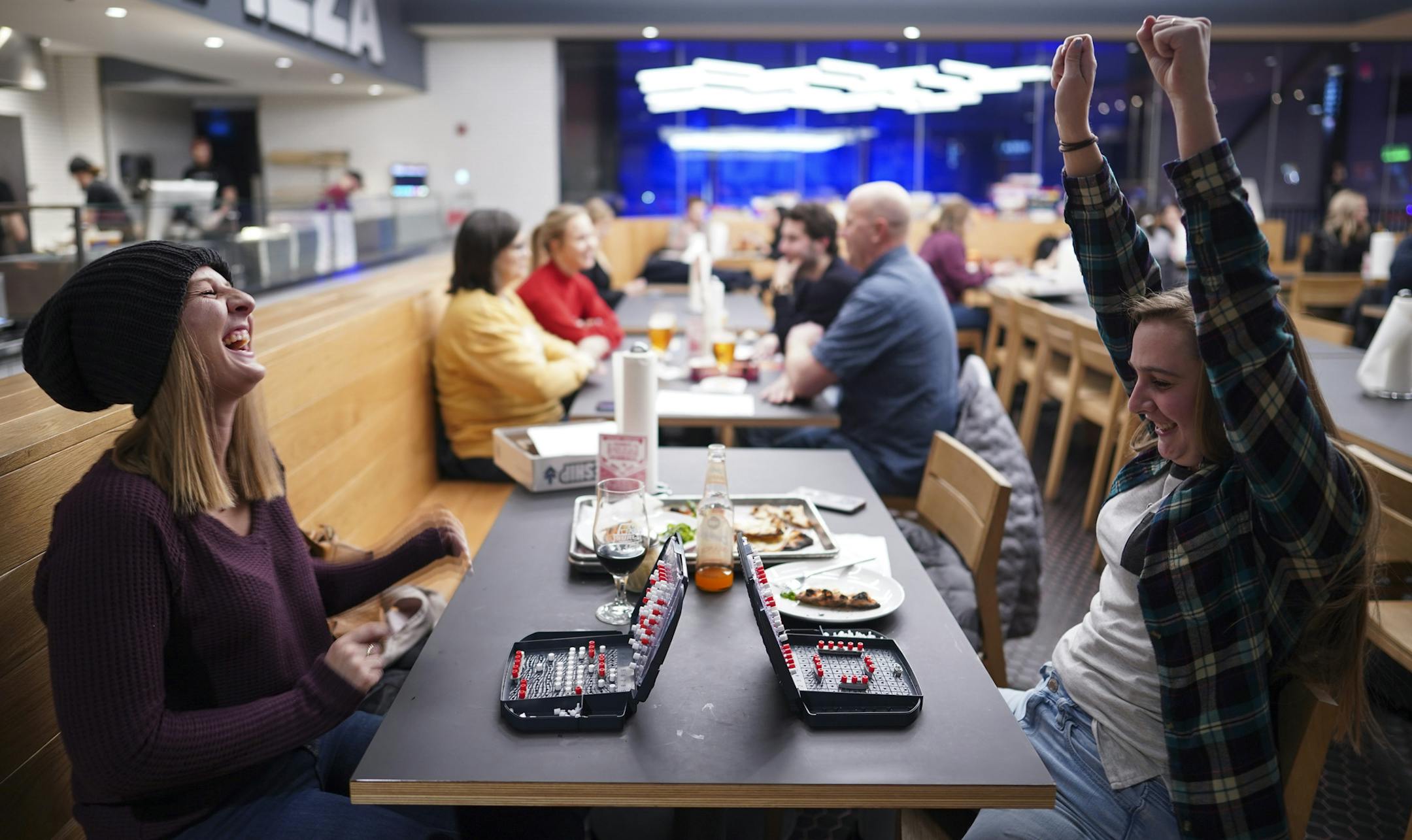Rebecca Moser rejoiced at beating her older sister, Kelsey, in a game of Battleship at Surly's Pizza Upstairs. ] JEFF WHEELER • Jeff.Wheeler@startribune.com Wednesday nights at Surly Pizza Upstairs is board game night. Patrons lingered over games long after their New Haven style pizzas were finished Wednesday night, January 29, 2020.