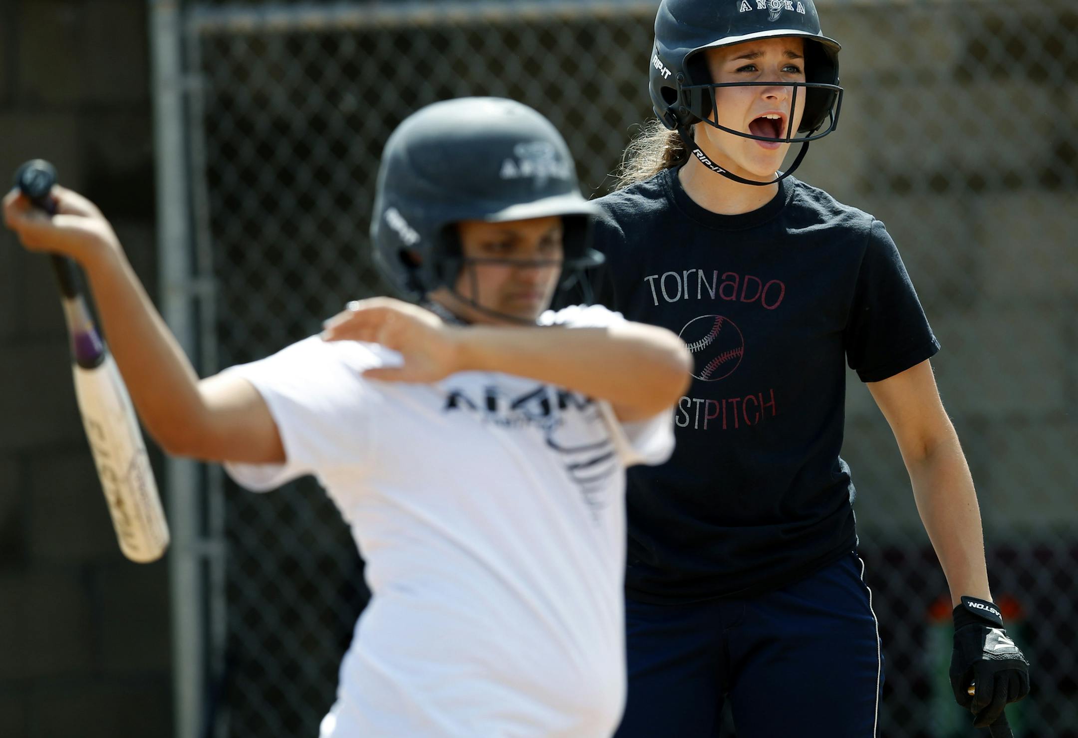 Anoka High School softball players Dayja Rosario and Megan Lindenfelser during practice on Monday. ] CARLOS GONZALEZ cgonzalez@startribune.com - June 2, 2014, Anoka, Minn., Anoka girls softball has qualified for its first ever state tournament.