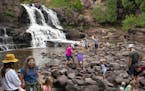 A large group of visitors stopped to enjoy Gooseberry Falls on Tuesday despite the pandemic. ] ALEX KORMANN • alex.kormann@startribune.com Despite, 