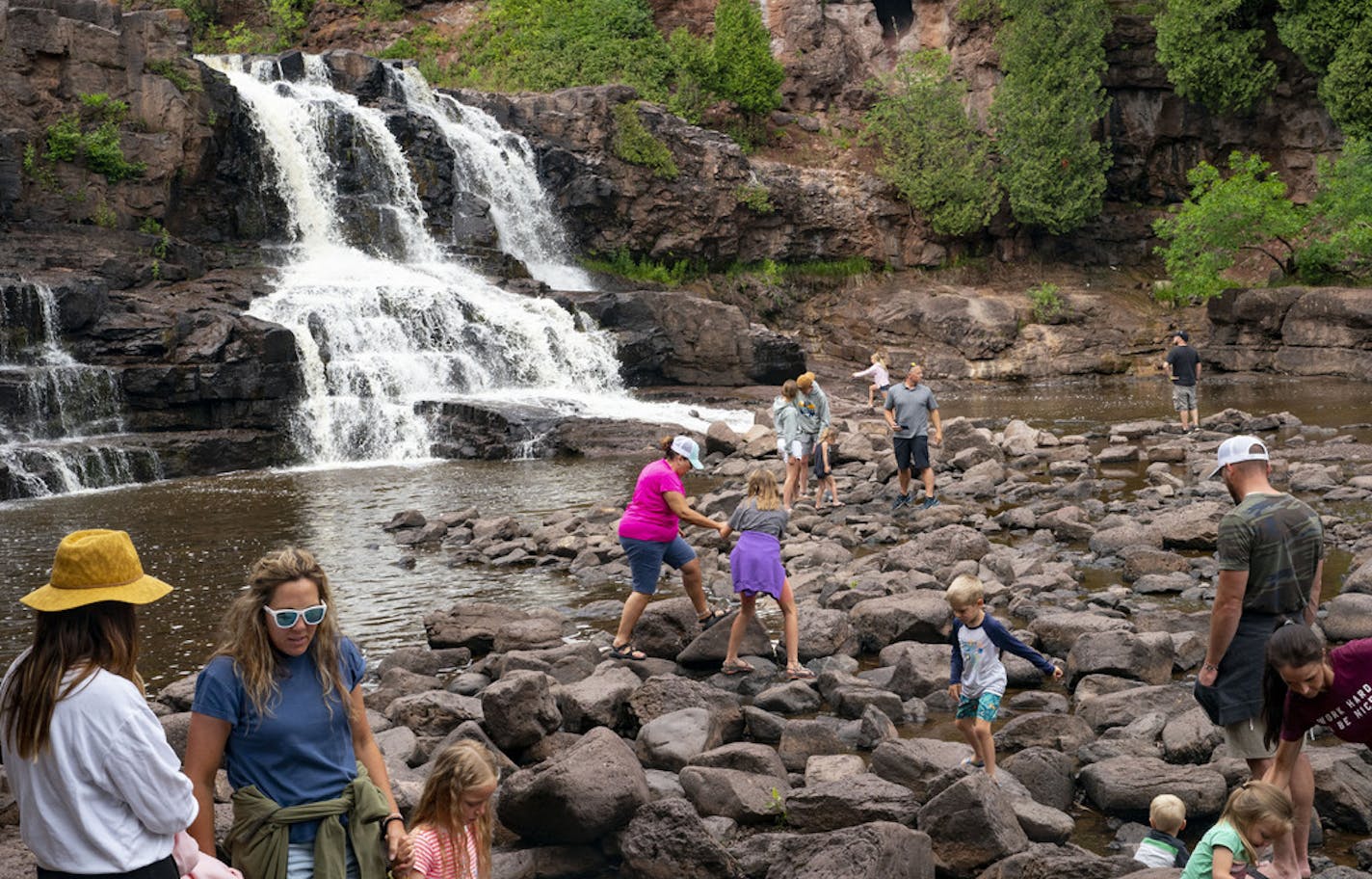 A large group of visitors stopped to enjoy Gooseberry Falls on Tuesday despite the pandemic. ] ALEX KORMANN • alex.kormann@startribune.com Despite, or more likely due to, the pandemic, North Shore campgrounds, resorts and vacation rentals are booked and state parks are often packed with visitors.