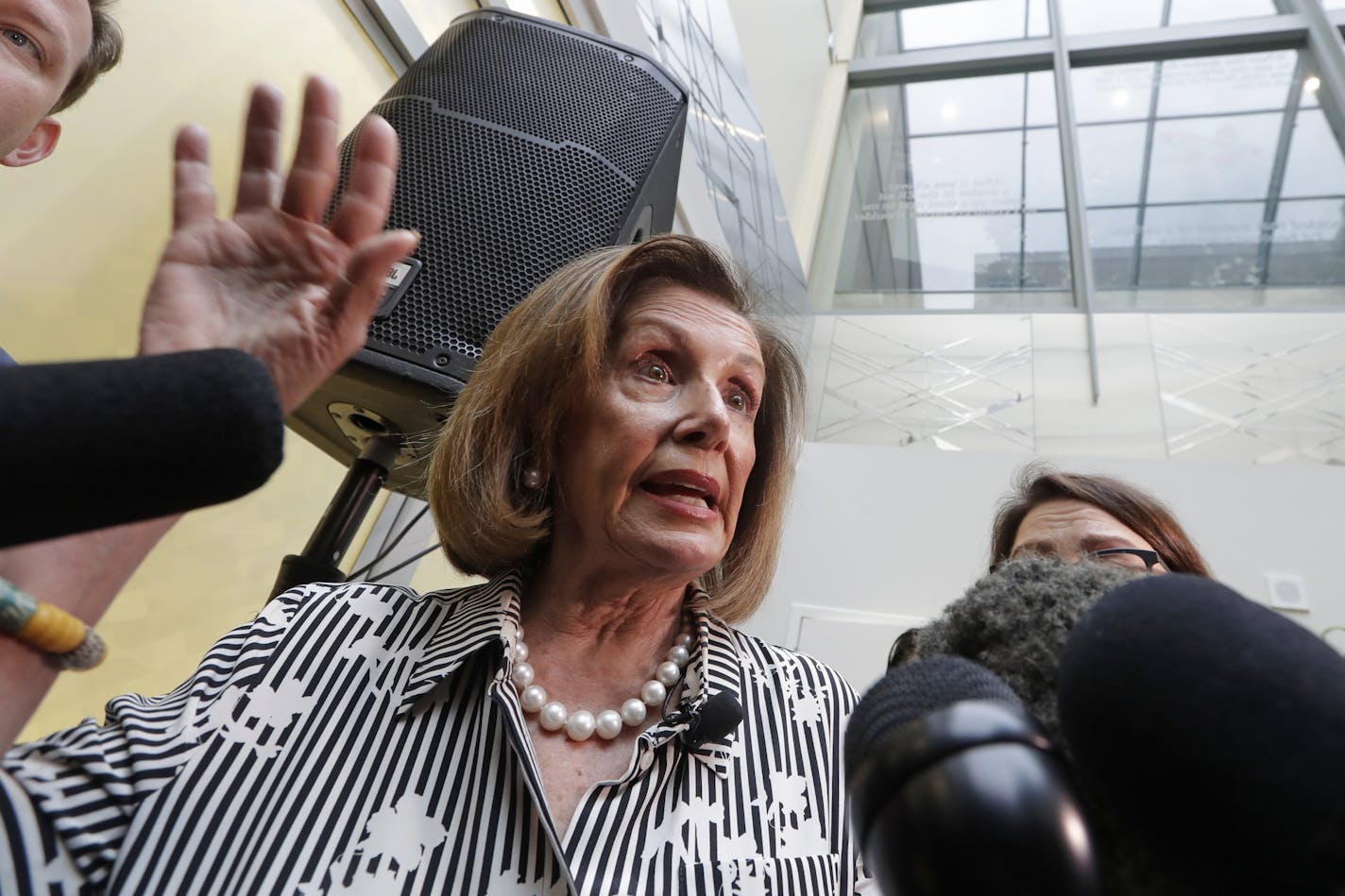 Speaker of the House Nancy Pelosi, D-Calif., talks with media members after speaking about lowering the cost of prescription drug prices Tuesday, Oct. 8, 2019, at Harborview Medical Center in Seattle. (AP Photo/Elaine Thompson)