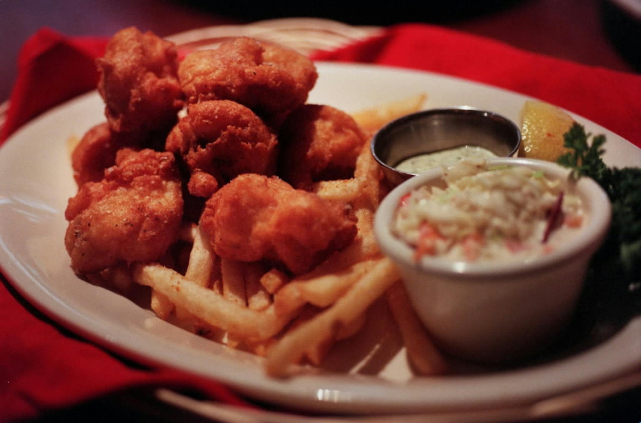 Appetizers such as fish and chips are half-price during Twin City Grill's happy hour.