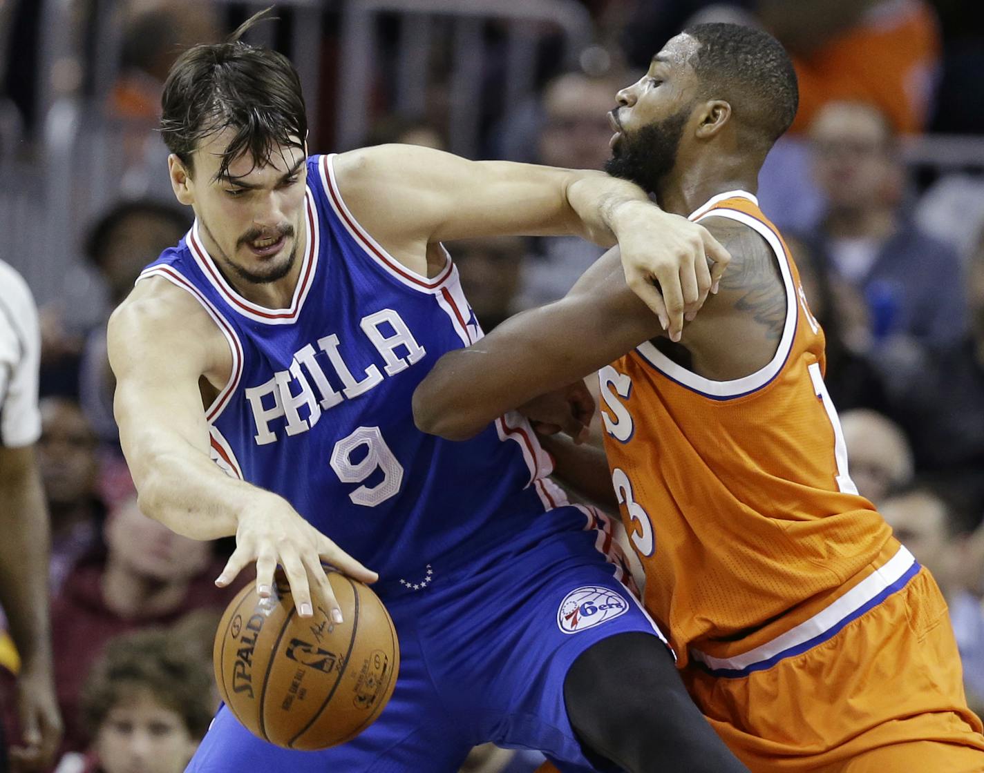 Philadelphia 76ers' Dario Saric (9), from Croatia, drives past Cleveland Cavaliers' Tristan Thompson in the first half of an NBA basketball game, Friday, March 31, 2017, in Cleveland. (AP Photo/Tony Dejak)