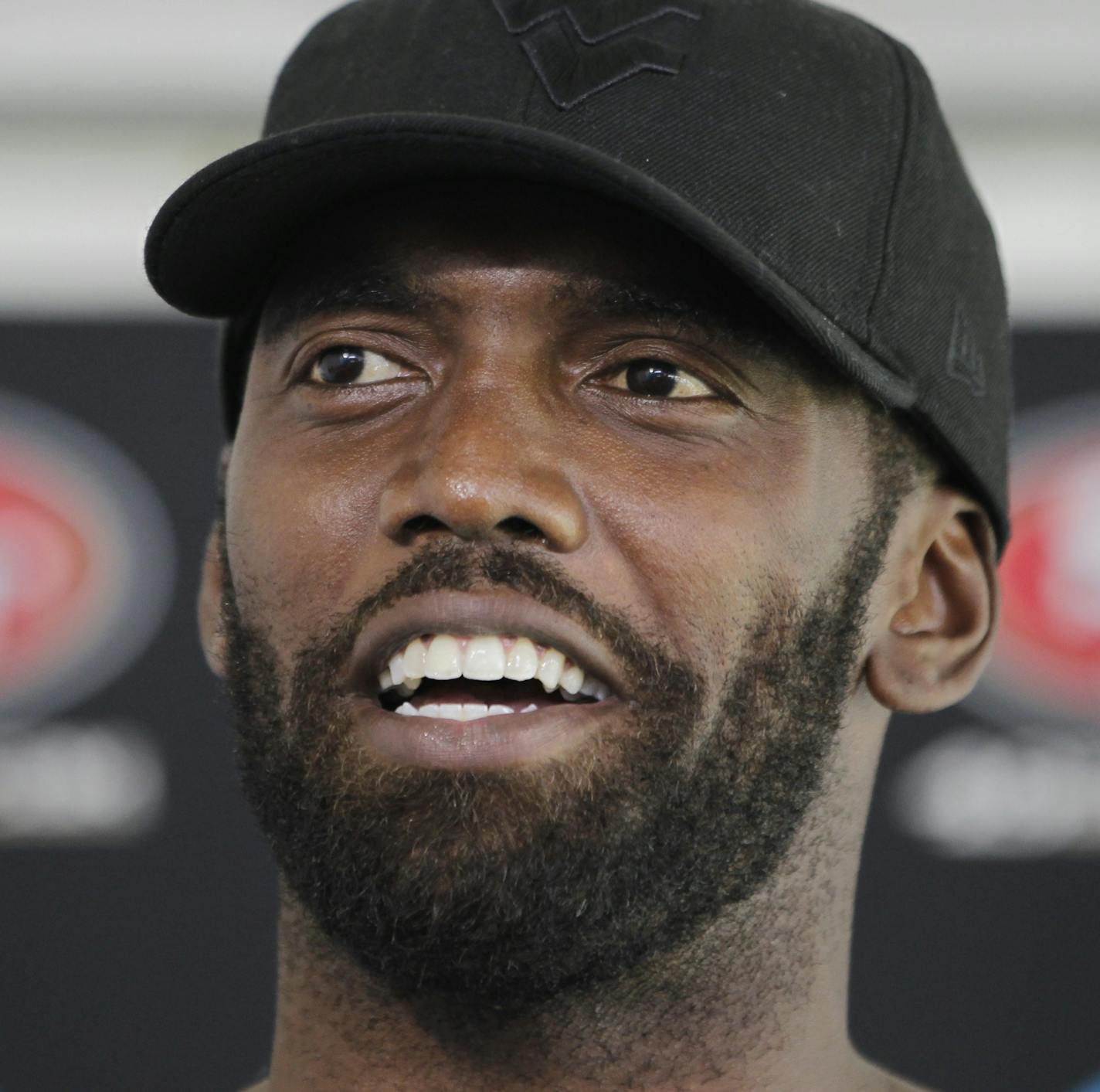 San Francisco 49ers wide receiver Randy Moss smiles during a news conference at NFL football headquarters in Santa Clara, Calif., Friday, July 27, 2012. (AP Photo/Paul Sakuma) ORG XMIT: MIN2013012116114722 ORG XMIT: MIN1308192047074437