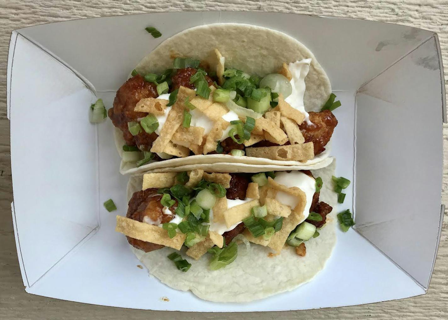 General Tso's Tacos, Taco Cat, International Bazaar, $12. The chicken is plump, juicy and plentiful, and the sauce has the requisite sweet-hot back-and-forth. (And the hot is totally Minnesota Hot, if you know what I mean). Wonderfully shareable. Photo by Rick Nelson New food at the Minnesota State Fair 2018