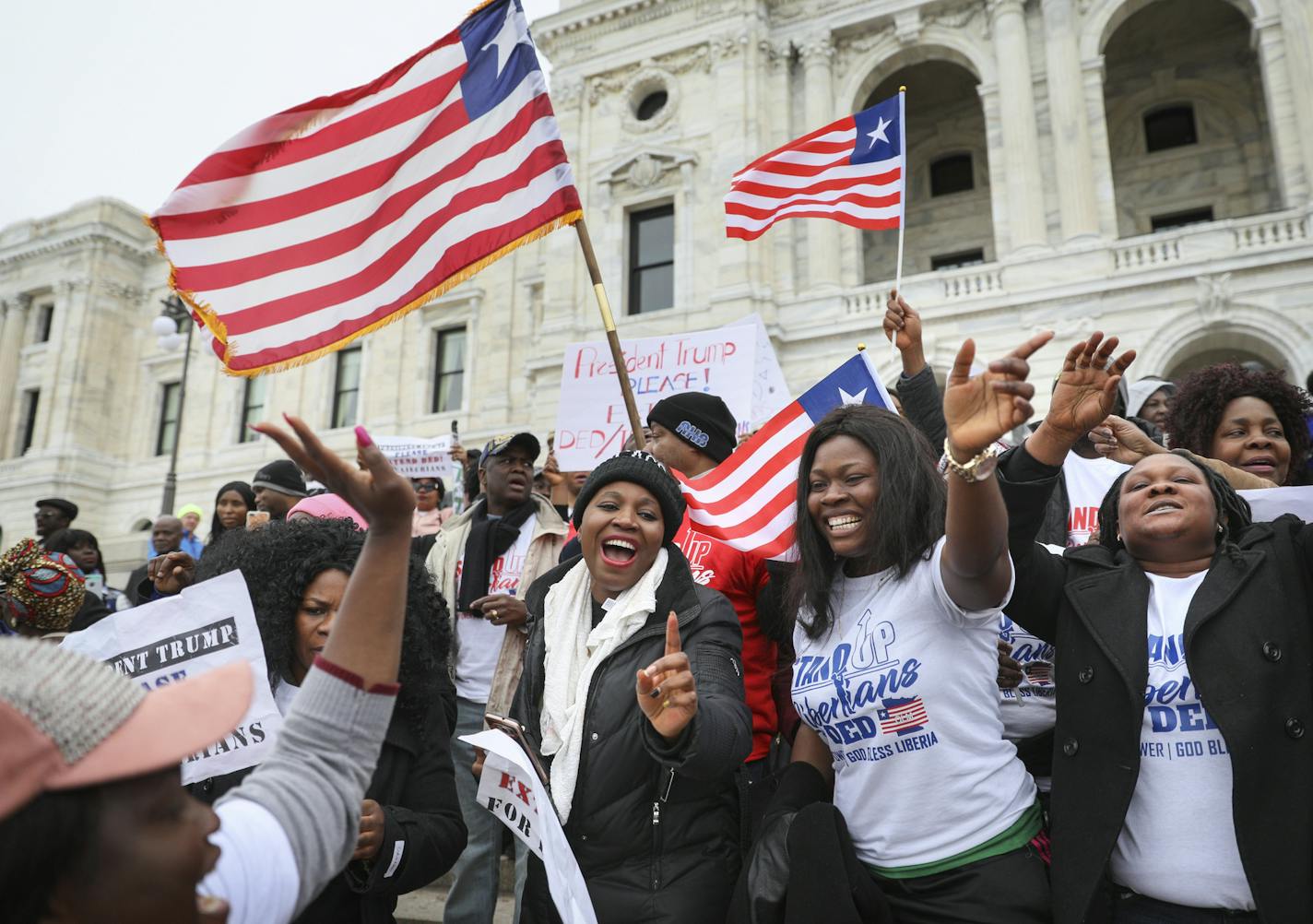 Hundreds of Twin Cities Liberians, including Evely Jarbatt (Center), gathered on the steps of the State Capitol a year ago for a rally in support of extending a federal program for Liberian natives called Deferred Enforced Departure, or DED.