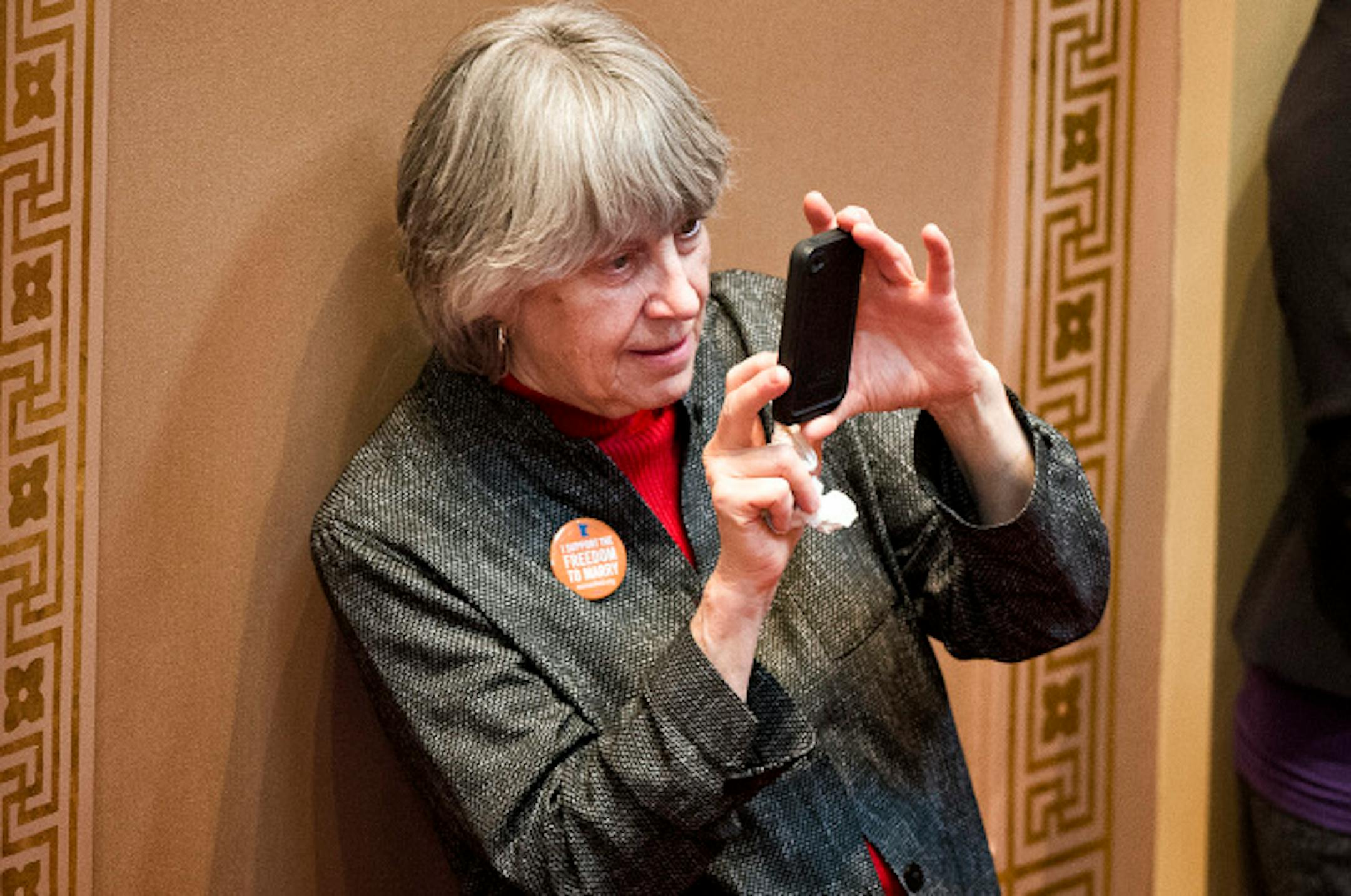 Rep. Karen Clark took a photo of Sen. Scott Dibble as he intriduced his bill on the Senate floor.   Marriage debate will start in the Senate.  Monday, May 13, 2013    ]   GLEN STUBBE * gstubbe@startribune.com