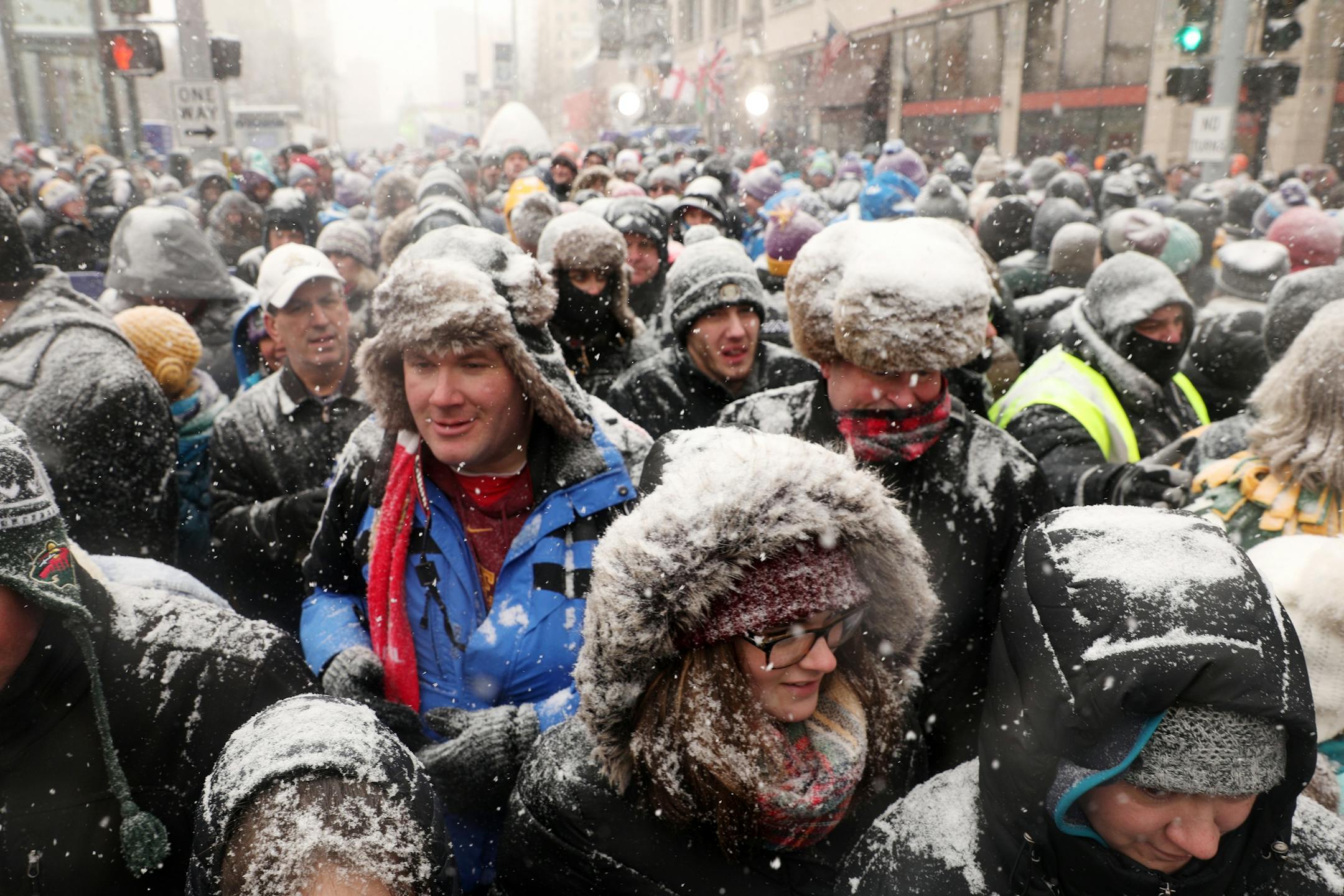 Super Bowl Live attendees made their way down Nicollet Mall after Levi LaValle leapt a snowmobile over the street for the Polaris UpsideDown stunt Saturday.