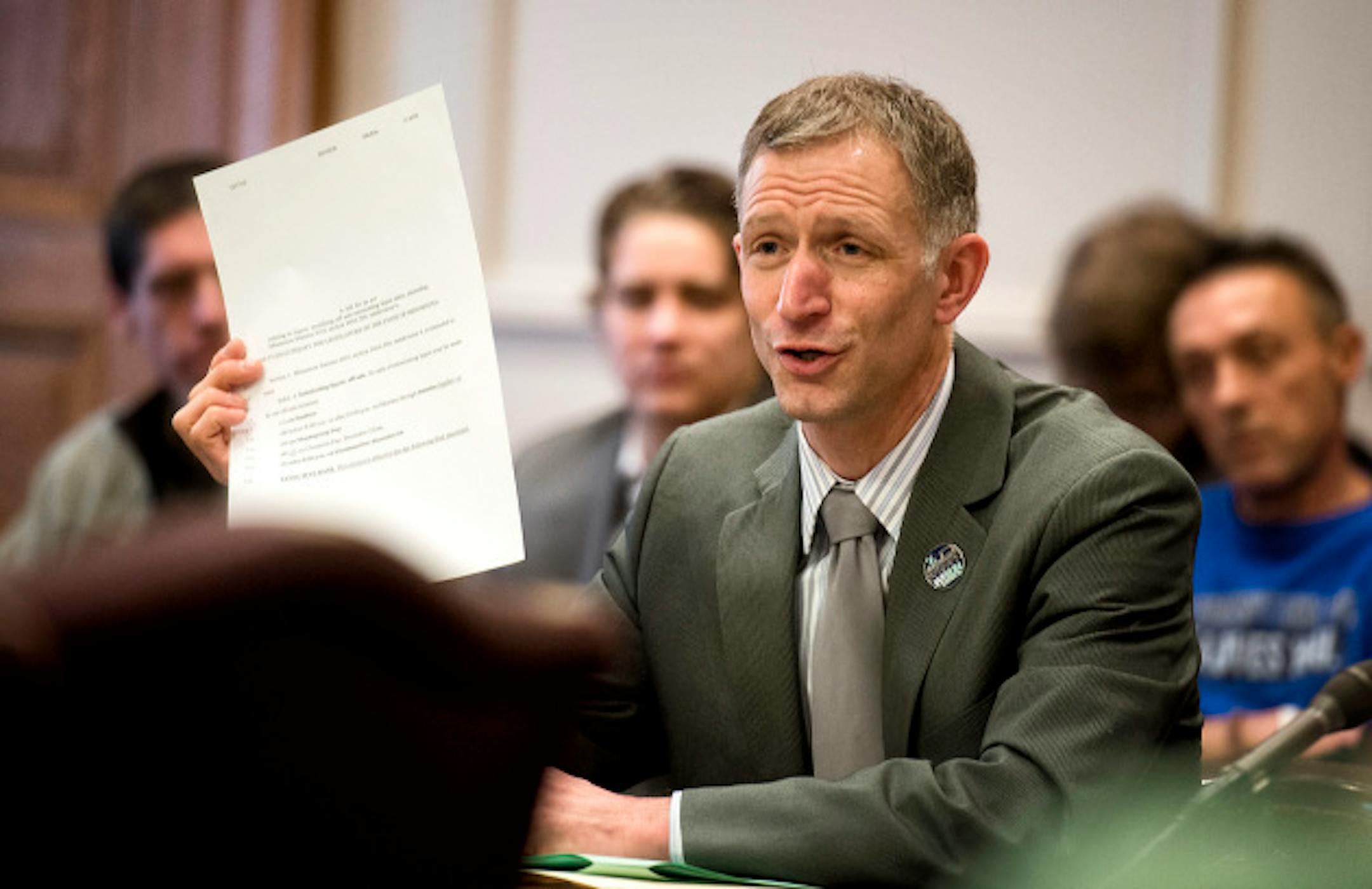 Senator Roger Reinhart  held up his one page  "very short bill"  at  a Senate commerce committee hearing for a bill that would allow liquor to be sold on Sundays in Minnesota.   Monday, February 25, 2013     ]   GLEN STUBBE * gstubbe@startribune.com