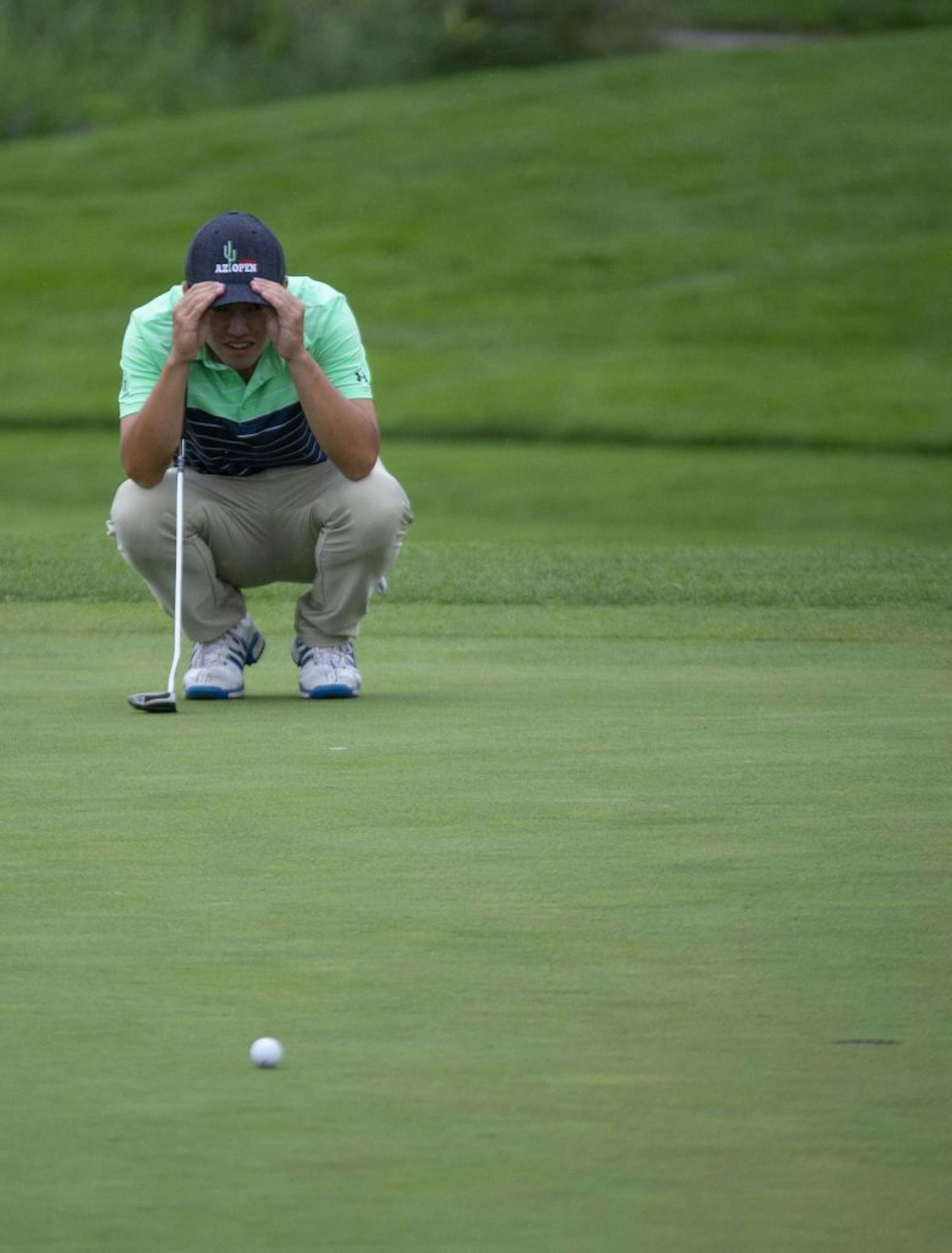 Bobby Park kneels down to try and better visualize the pitch of the putting green. ALEX KORMANN ¥ alex.kormann@startribune.com A Monday qualifying round round of golf was held at Victory Links course on Monday July 1, 2019 to determine who would make the cut for the 3M open to be held this week. Many hopefuls played their hearts out in an effort to earn one of four spots up for grabs in the PGA Tour event.