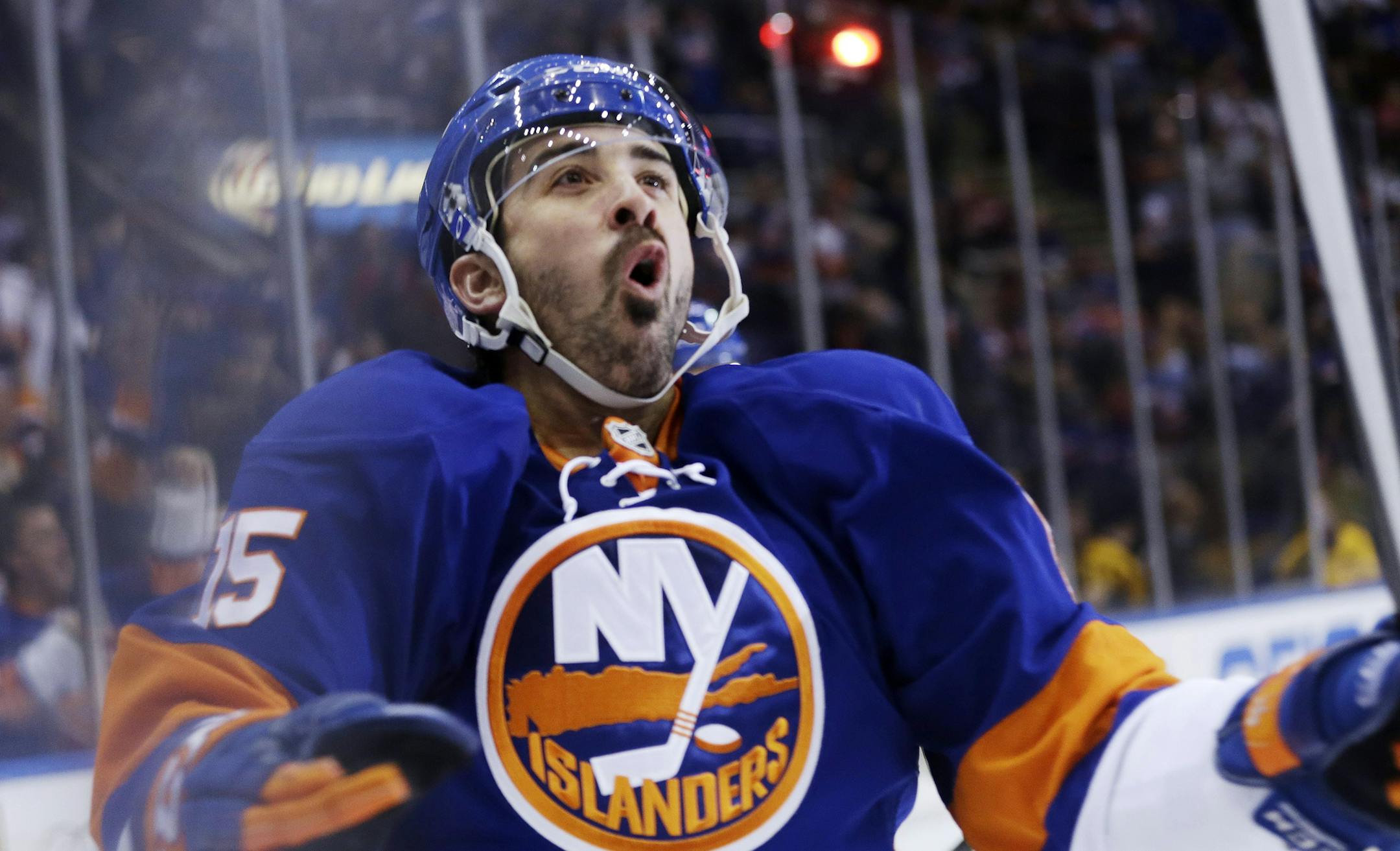 New York Islanders' Cal Clutterbuck celebrates after scoring a goal during the second period of an NHL hockey game against the New York Rangers Tuesday, Oct. 29, 2013, in Uniondale, N.Y. (AP Photo/Frank Franklin II) ORG XMIT: NYI109