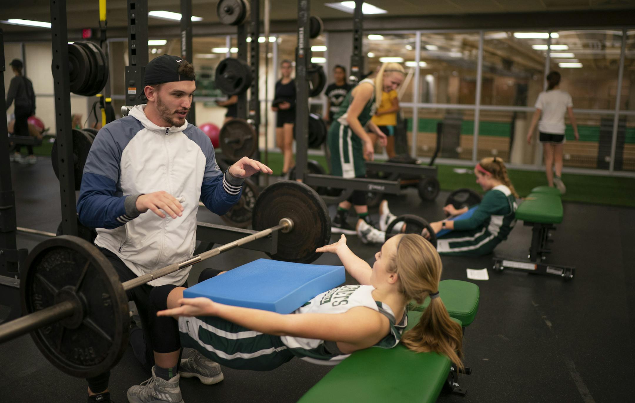 Edina players moved to their fitness center where Caroline Murray trained with weights under the direction of Scott Schriever, a strength & conditioning coach with Twin Cities Orthopedics.