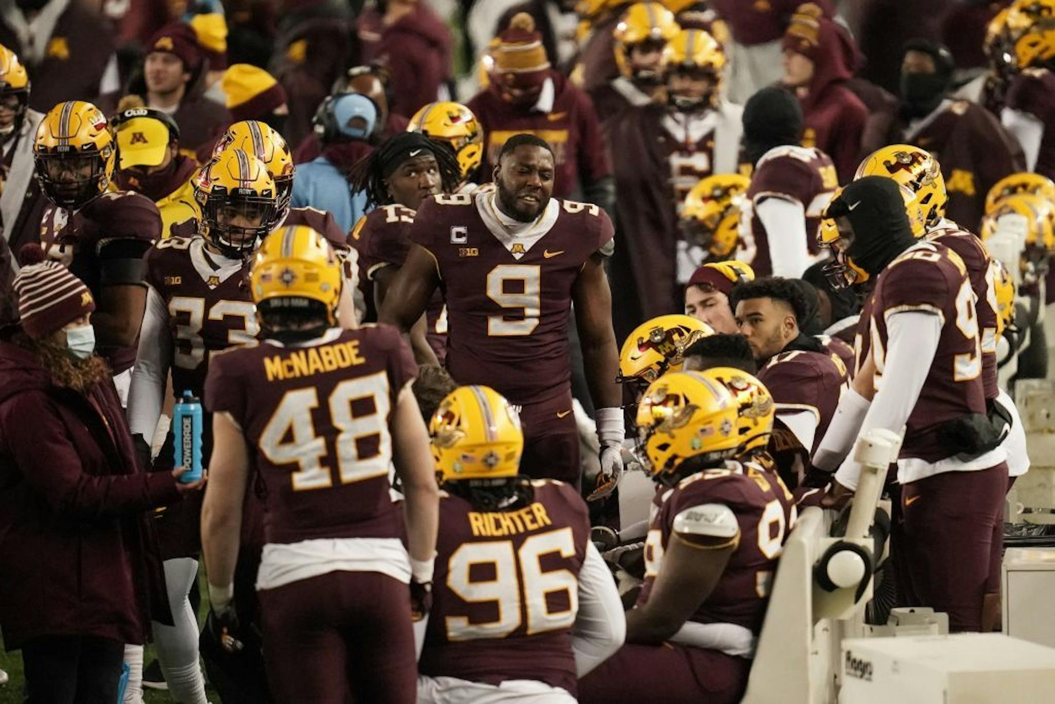 Minnesota Gophers defensive lineman Esezi Otomewo (9) got emotional with his teammates after Iowa scored a touchdown in the fourth quarter.