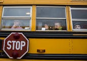 Students sit on the bus at the end of the school day at Eastview Elementary School in Lakeville on Wednesday, November 11, 2015.