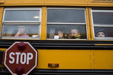 Students sit on the bus at the end of the school day at Eastview Elementary School in Lakeville on Wednesday, November 11, 2015.