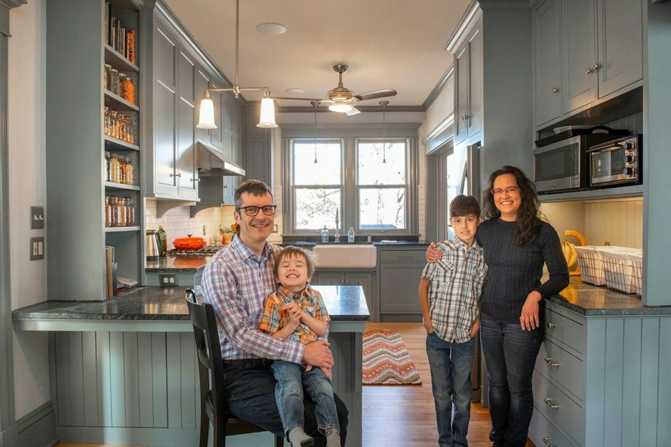 Nathan Lockwood, left, and Daisy Cross, right, bought their house in Northeast Minneapolis 20 years ago when they were grad students at the U. They recently remodeled to better accommodate family life with their children, Malcolm, 3, and Ian, 9.