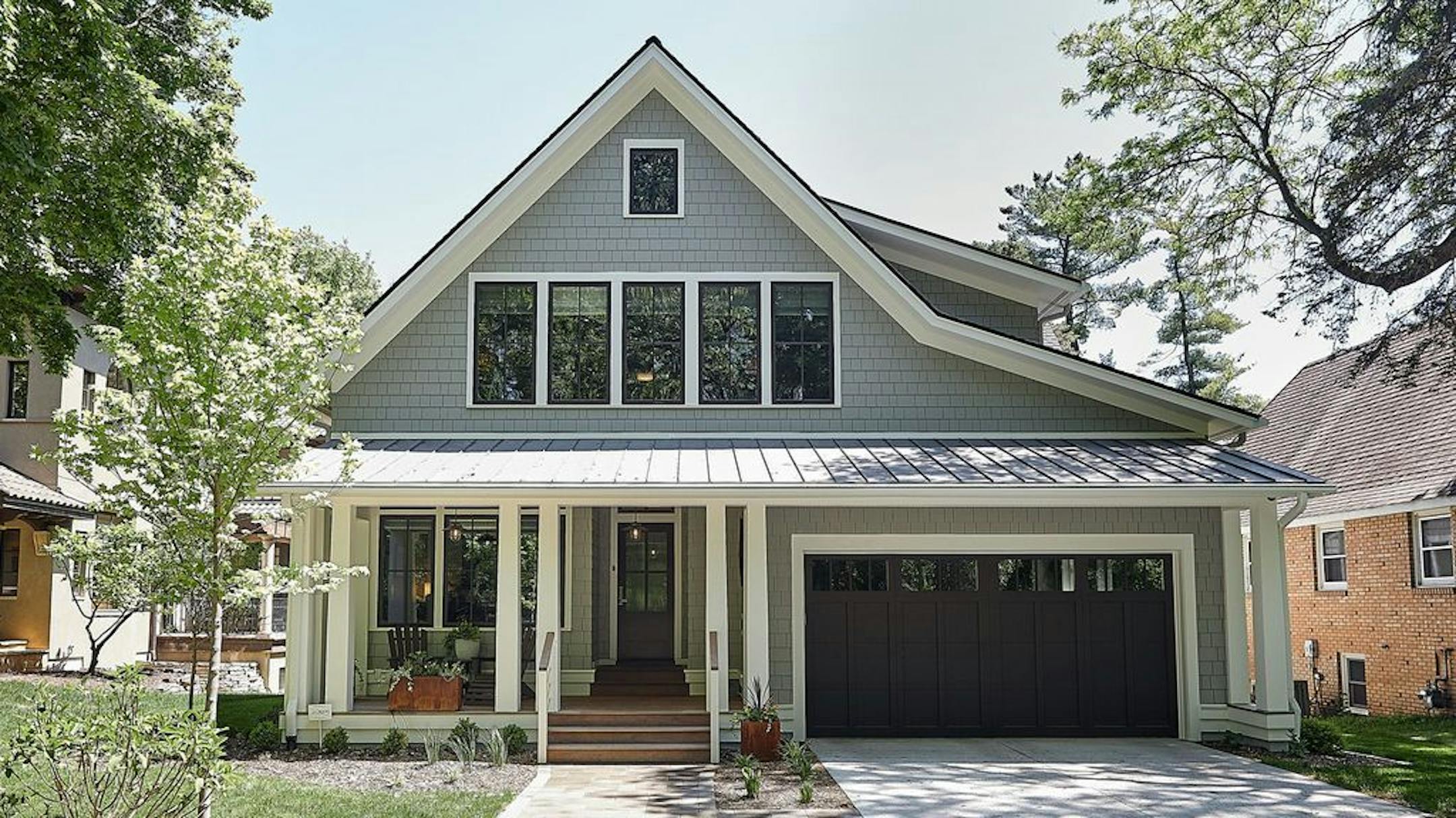 This new house blends with the architectural styles in the older Minneapolis neighborhood, by Christine Albertsson, Albertsson Hansen Architecture. If features a welcoming front porch and two stacked screen porches on the back.
