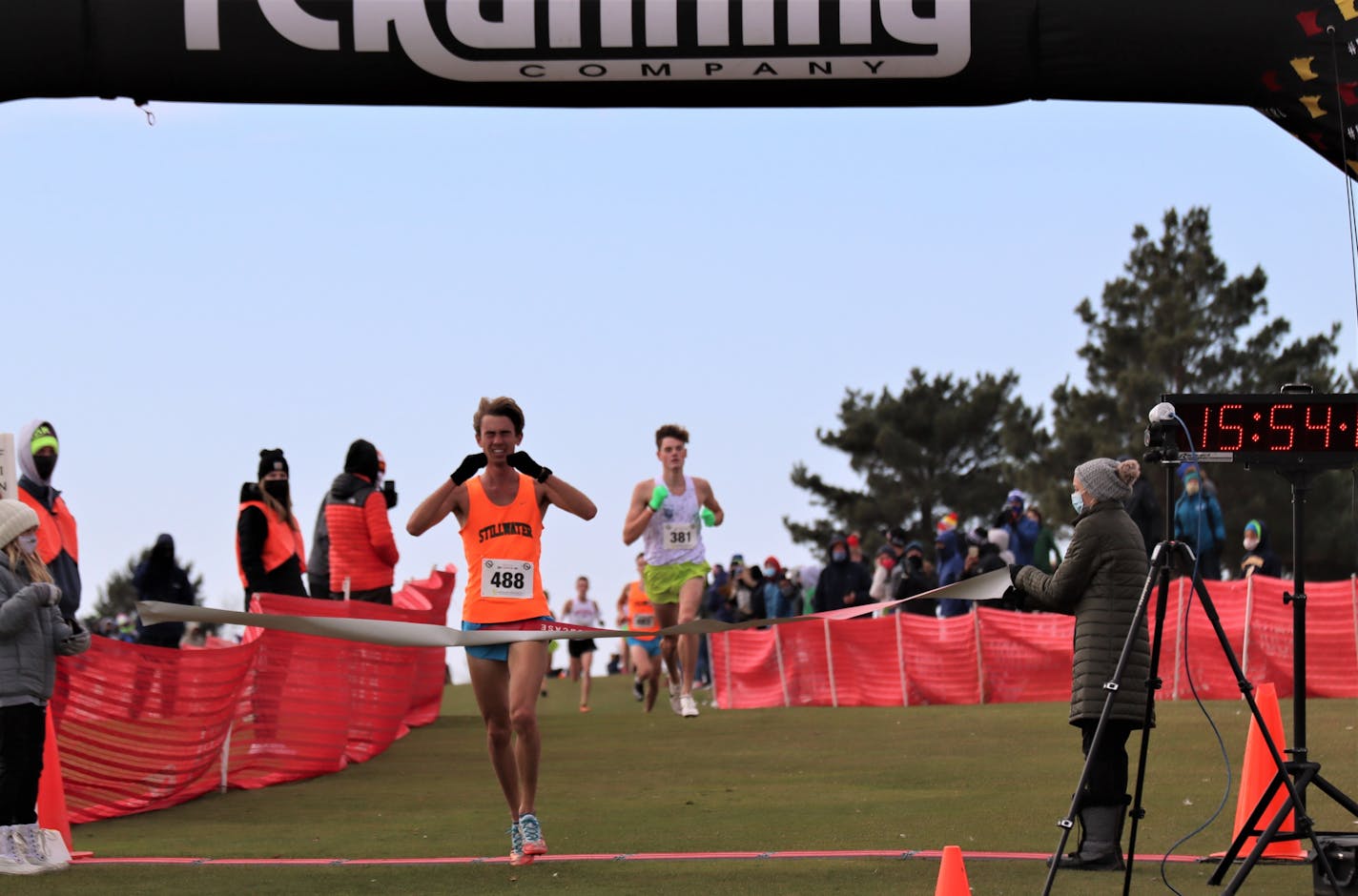 Stillwater's Ethan Vargas crossed the finish line at the TC Running Company cross-country race on Oct. 30.