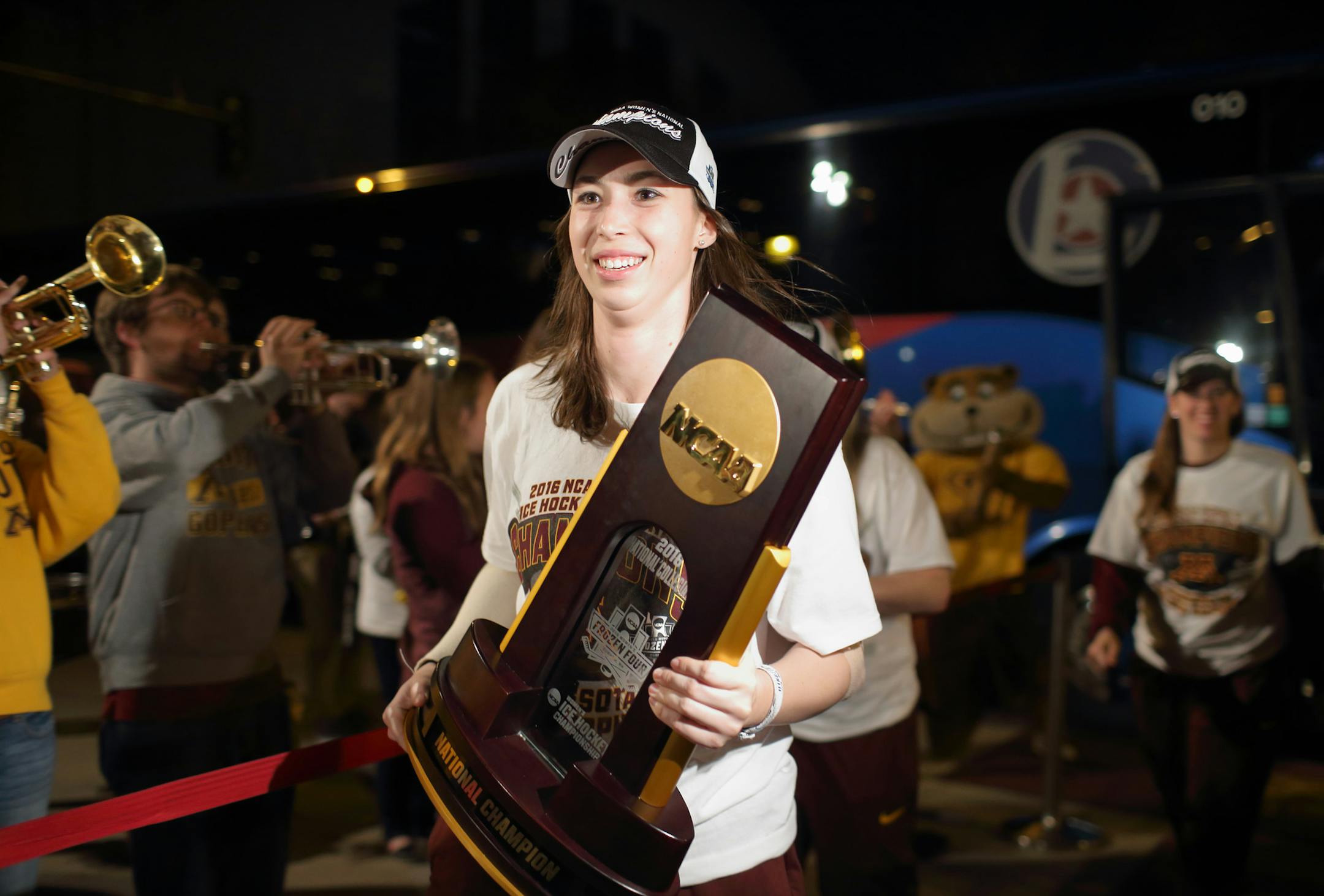 Milica McMillen had the honor being first off the bus with the NCAA championship trophy after the Gophers women’s hockey team arrived at Ridder Arena early Monday morning.